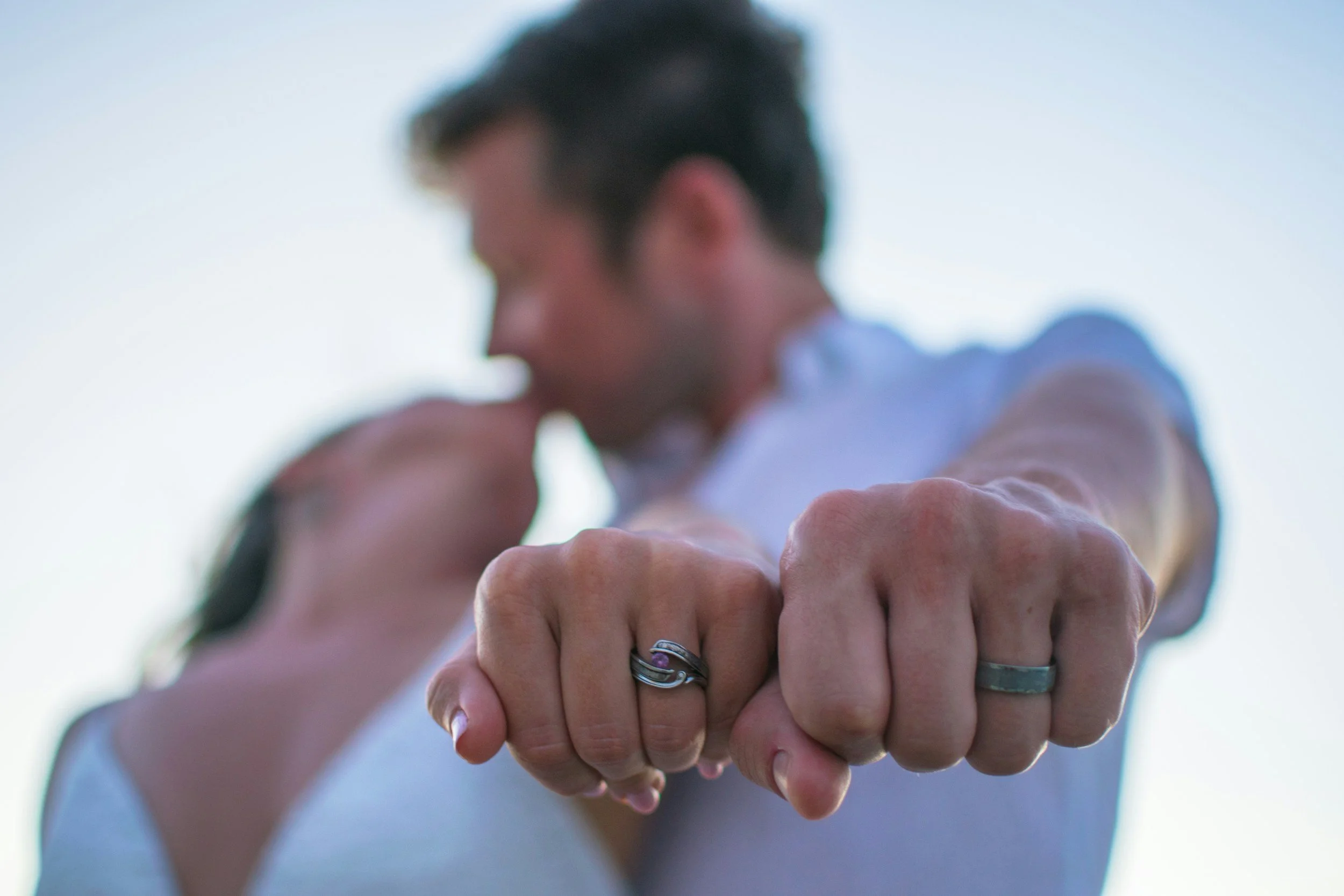 Engaged couple showing rings and sharing a joyful moment after pre-marital counselling in Edmonton