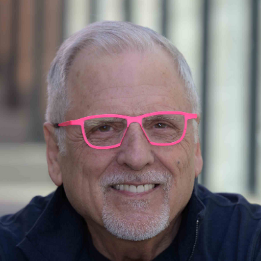 Photo of Neil Anderson, a white older man with gray hair and bright pink glasses.