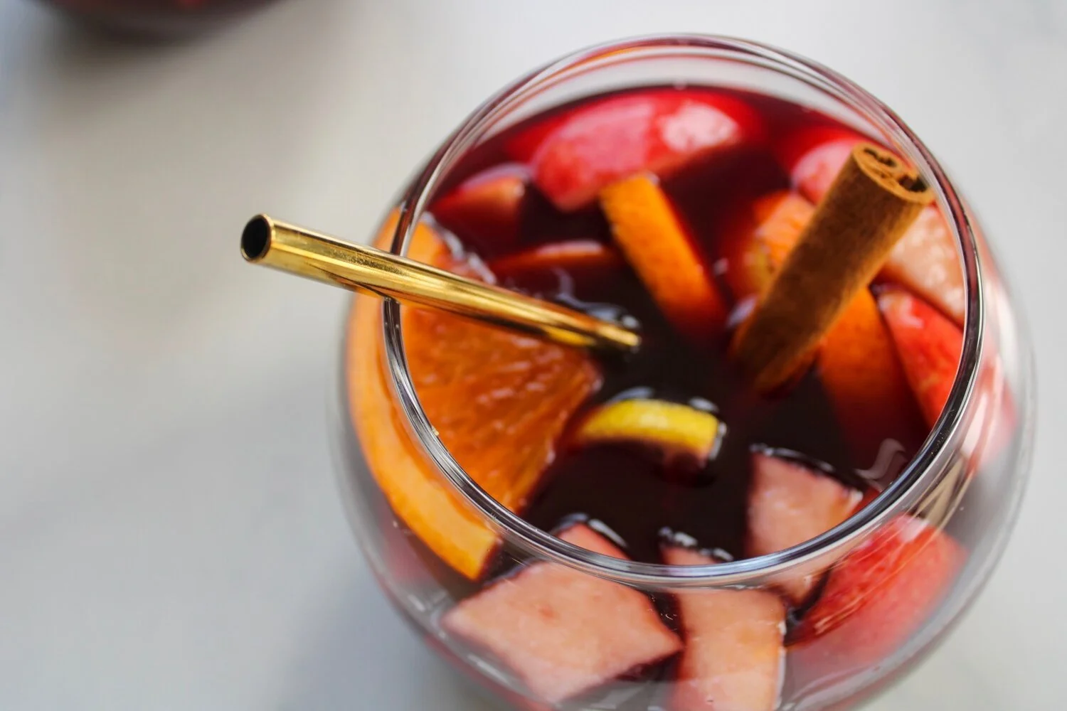 overhead shot of sangria with chopped fruits