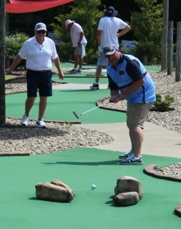Danny Baddeley (Hendersonville, NC) takes an aggressive line through the rocks on hole 17 while Danny Tatum (Fernandina Beach, FL) watches on