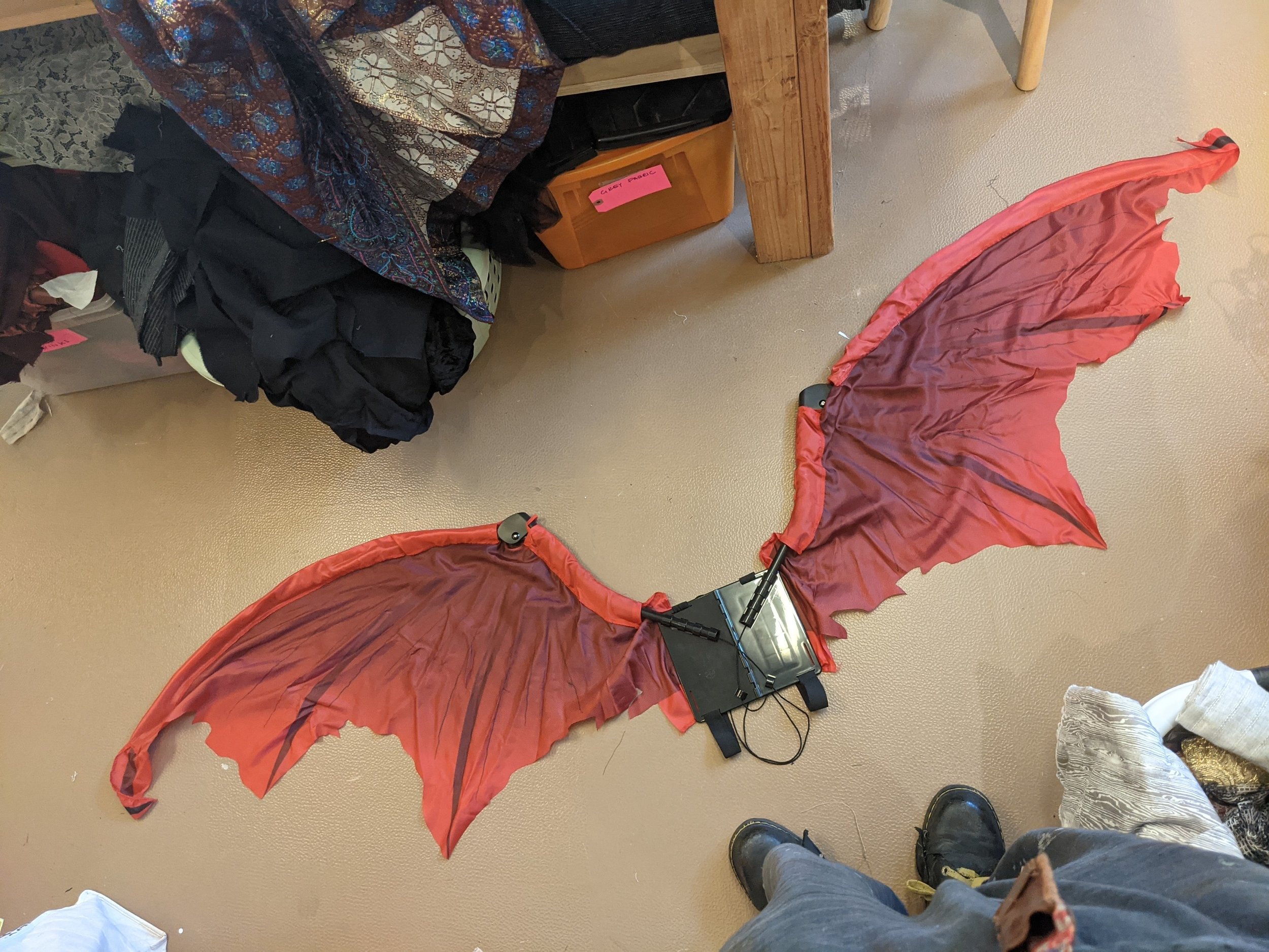 Wings base purchased from Amazon. Straps go under arms, and wings unfold by pulling hanging strings.