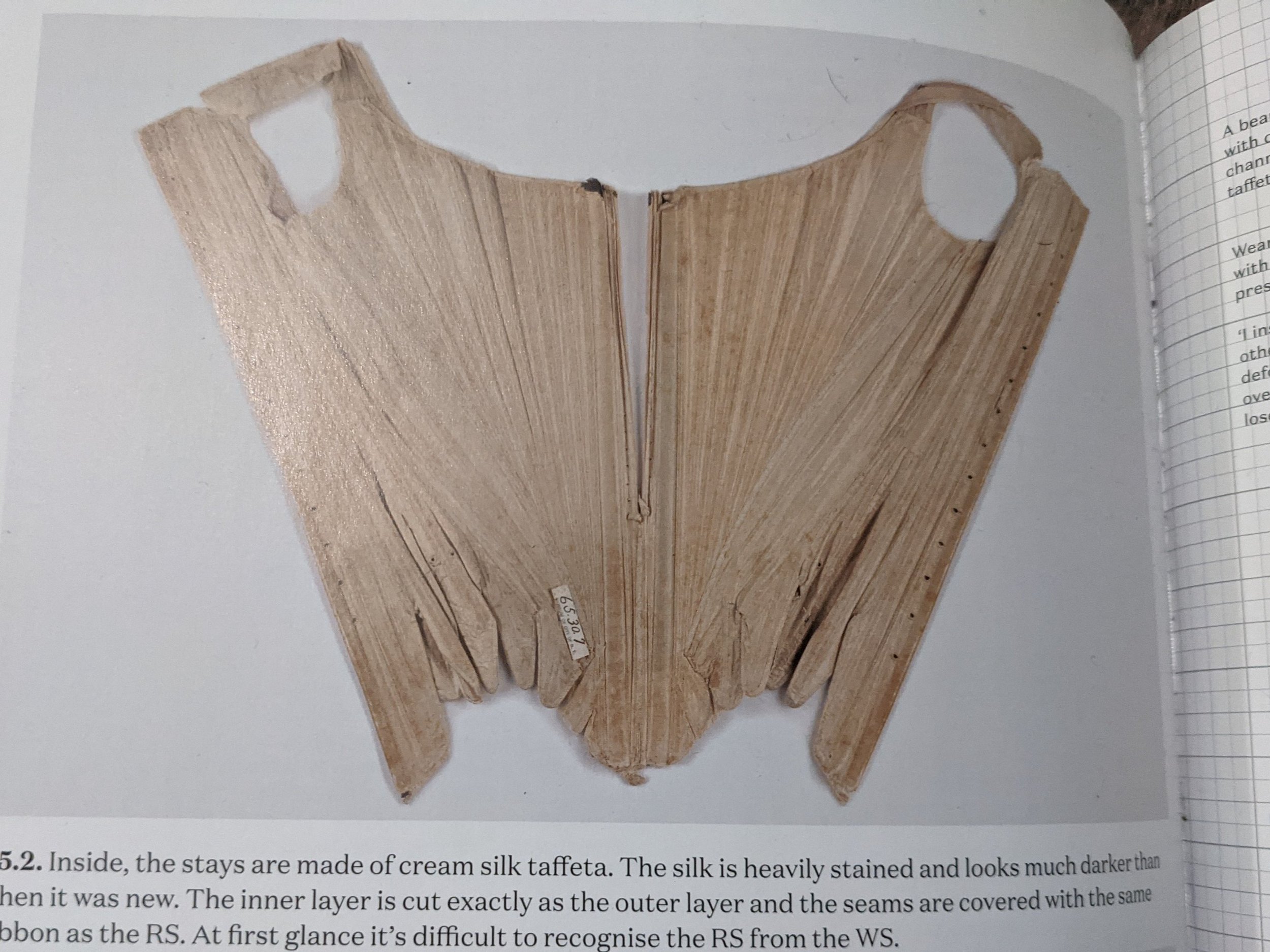 Photo of extant garment. 17th century reversible half-boned stays.