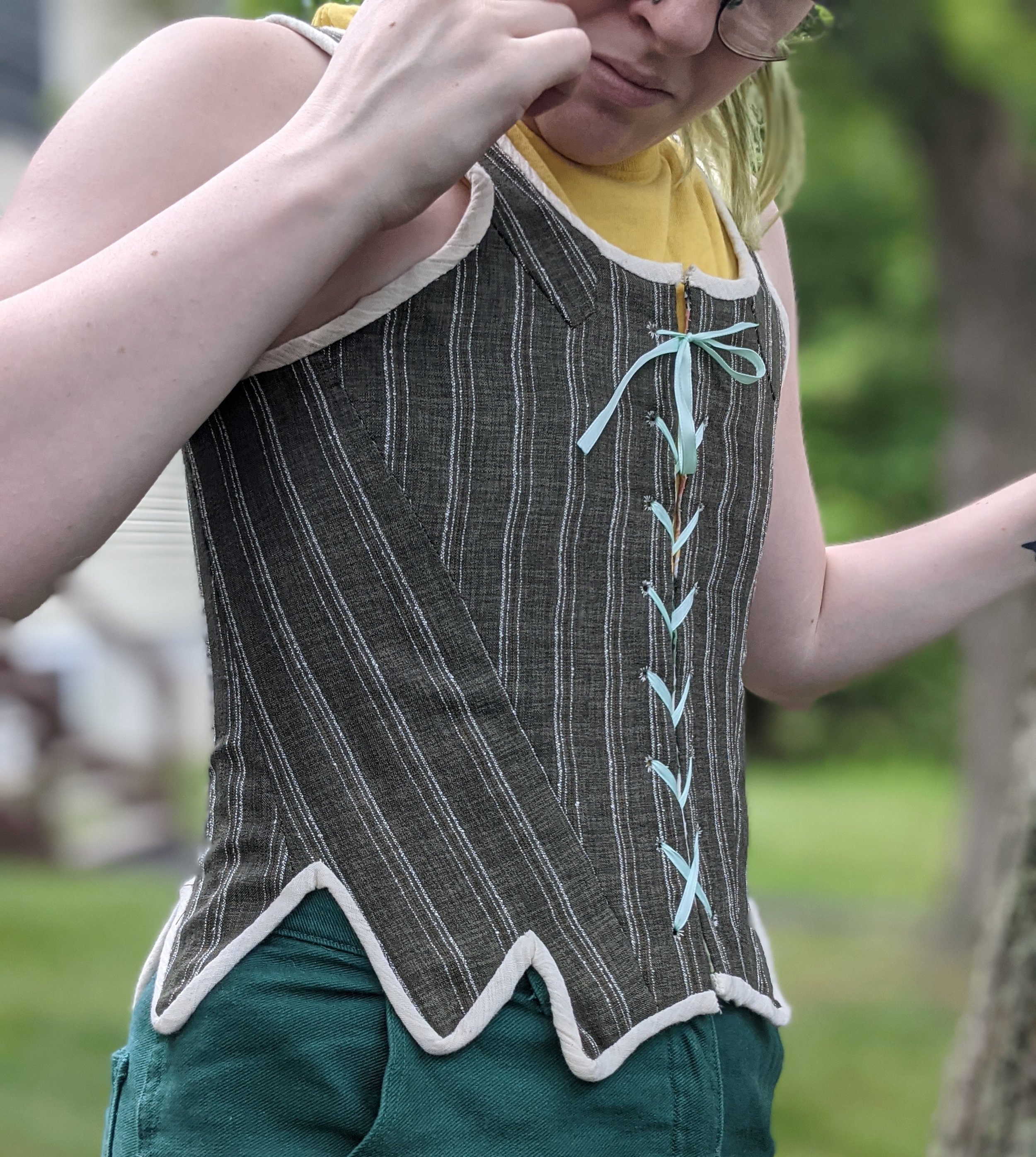 The finished pair is a reversible half-boned pair of stays, with a center front closure.