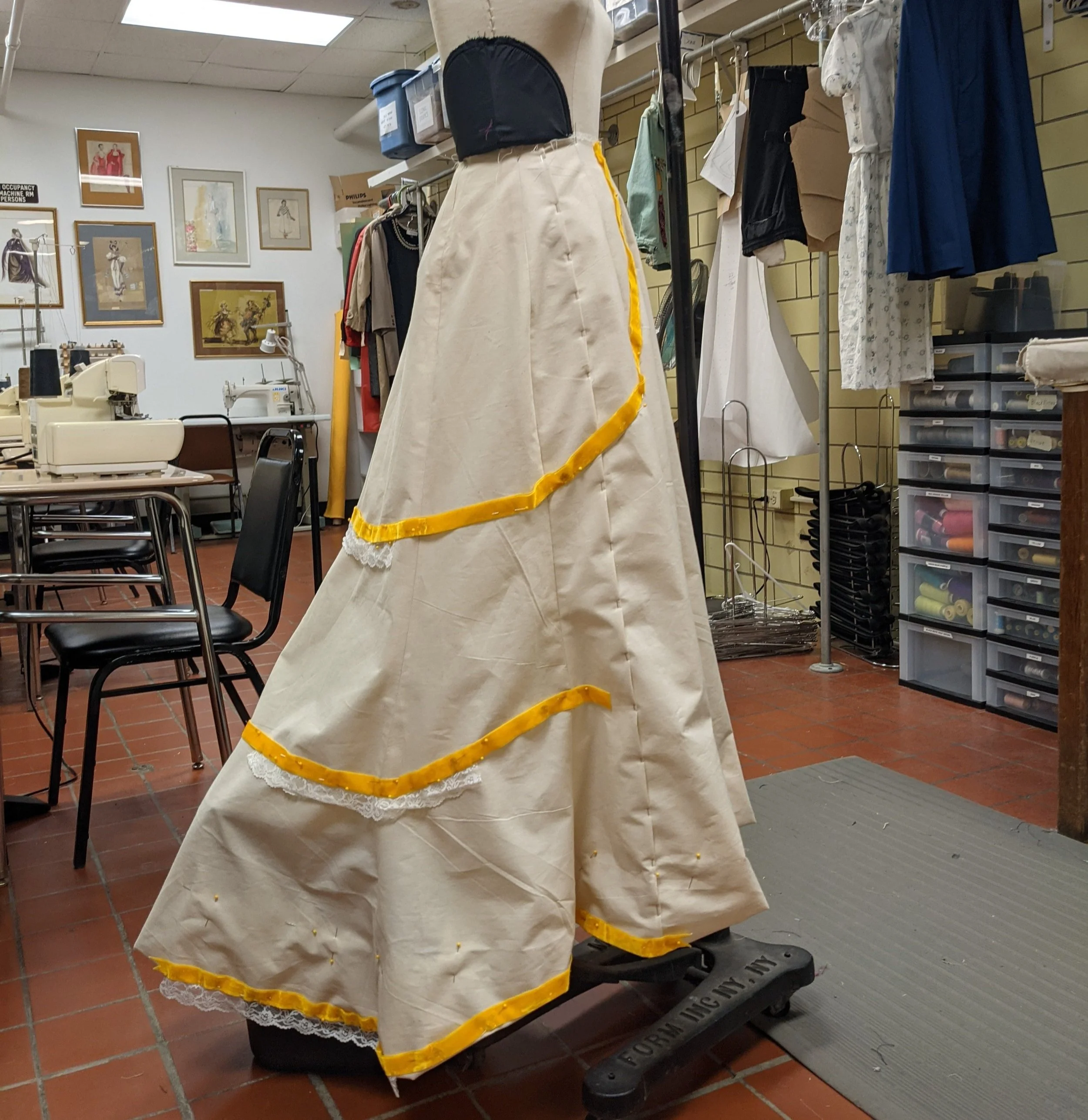 I drafted the skirt based on Edwardian trumpet skirts, and made a mockup with two hems for the designer to choose -- they chose the longer more dramatic hem.