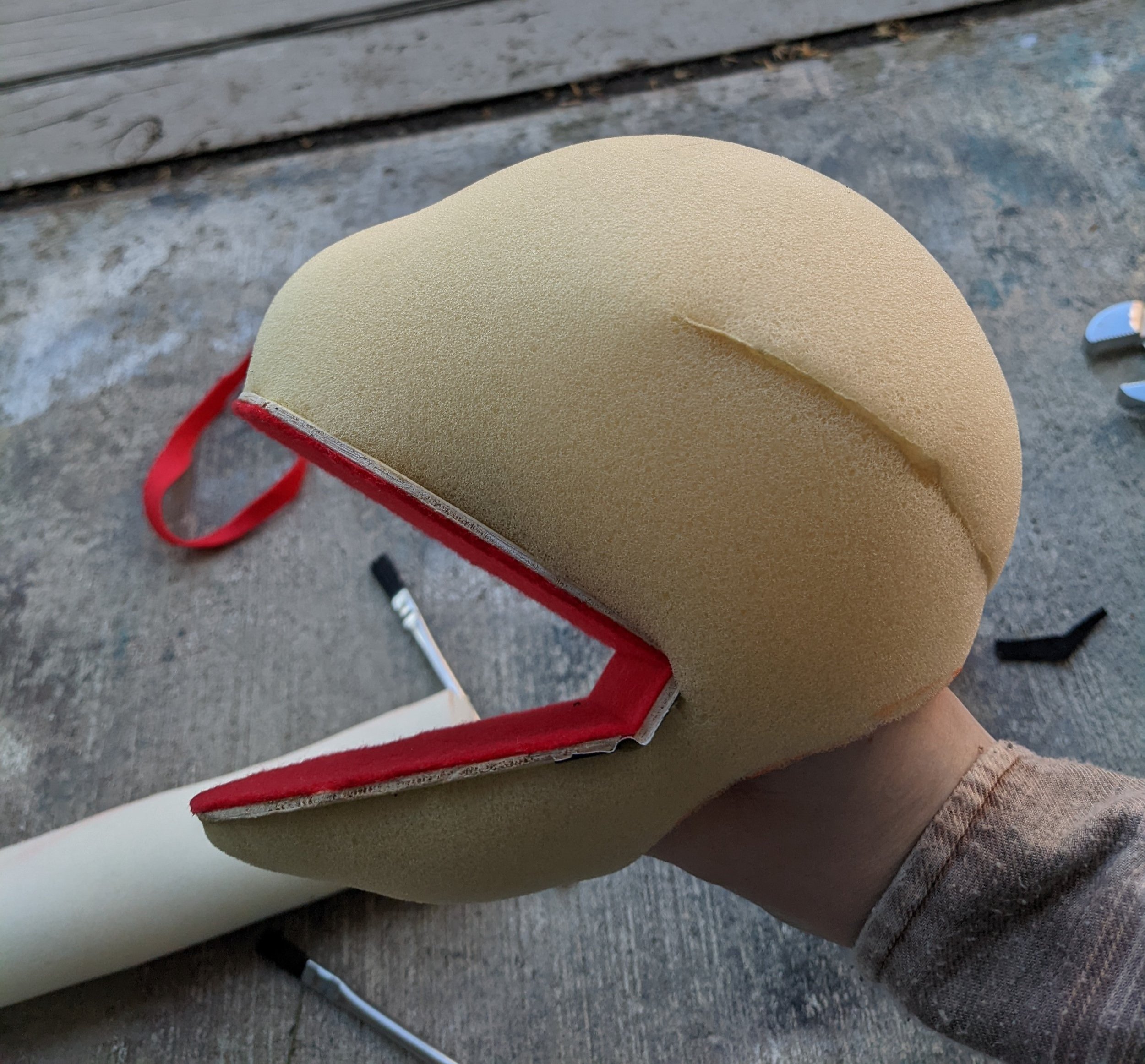 I attached the foam head to the mouth plate with contact cement, and checked the fit on my hand.