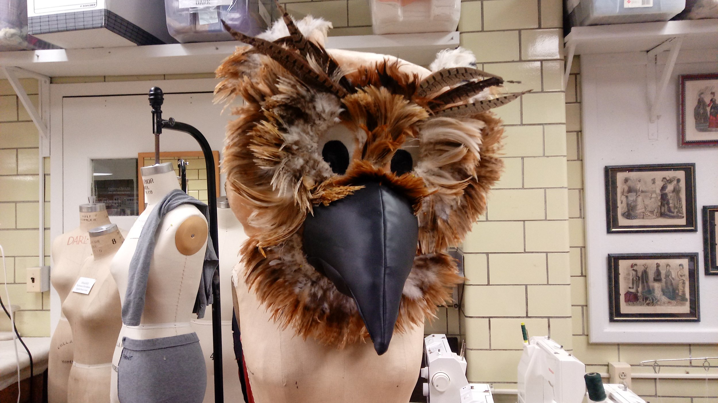 Then, I draped feathers over the face, and stitched that and the beak down. The beak is pleather with a bone in the center for structure.