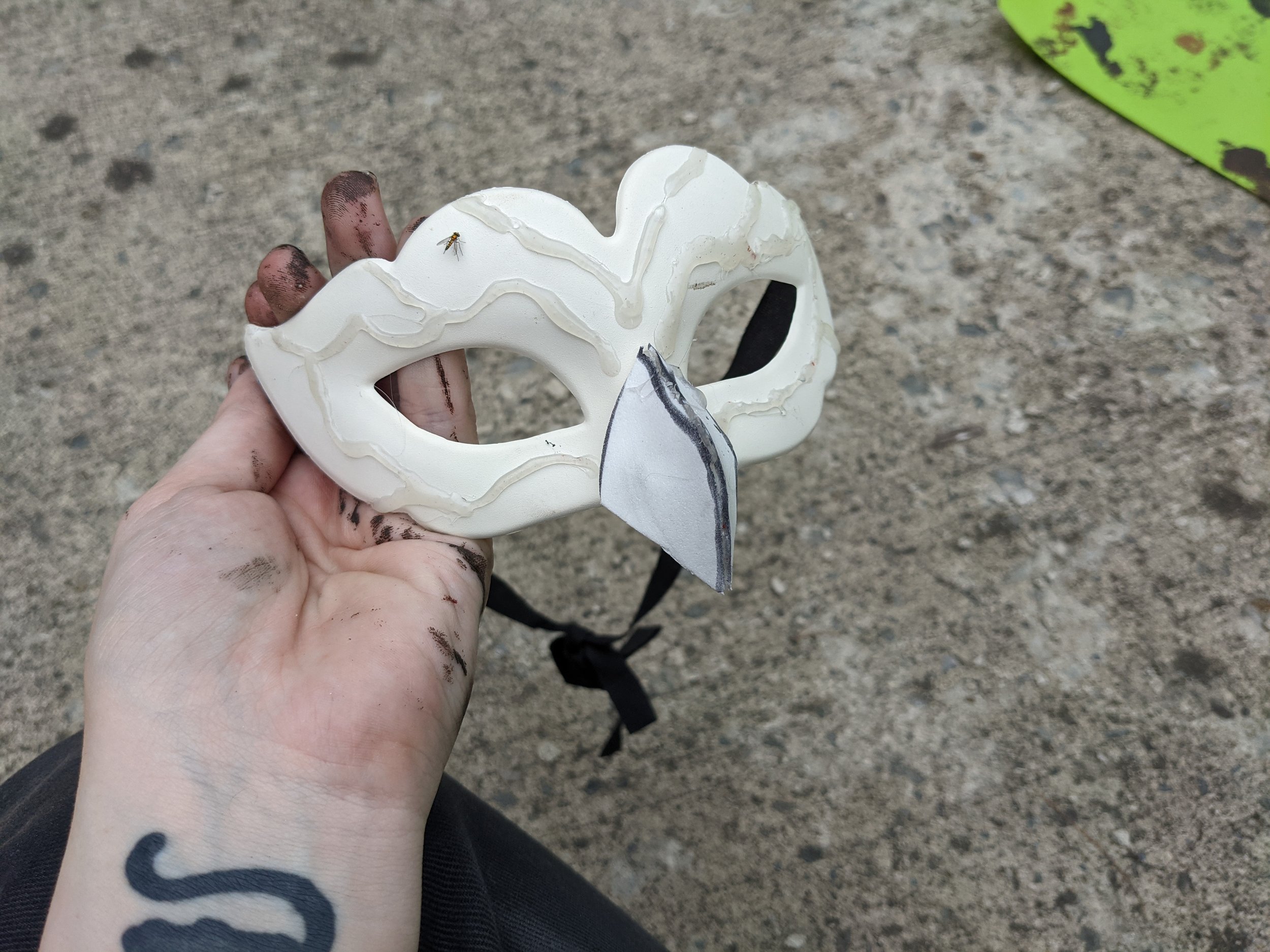 Mask blank with hot glue texturing and beak made from EVA foam.
