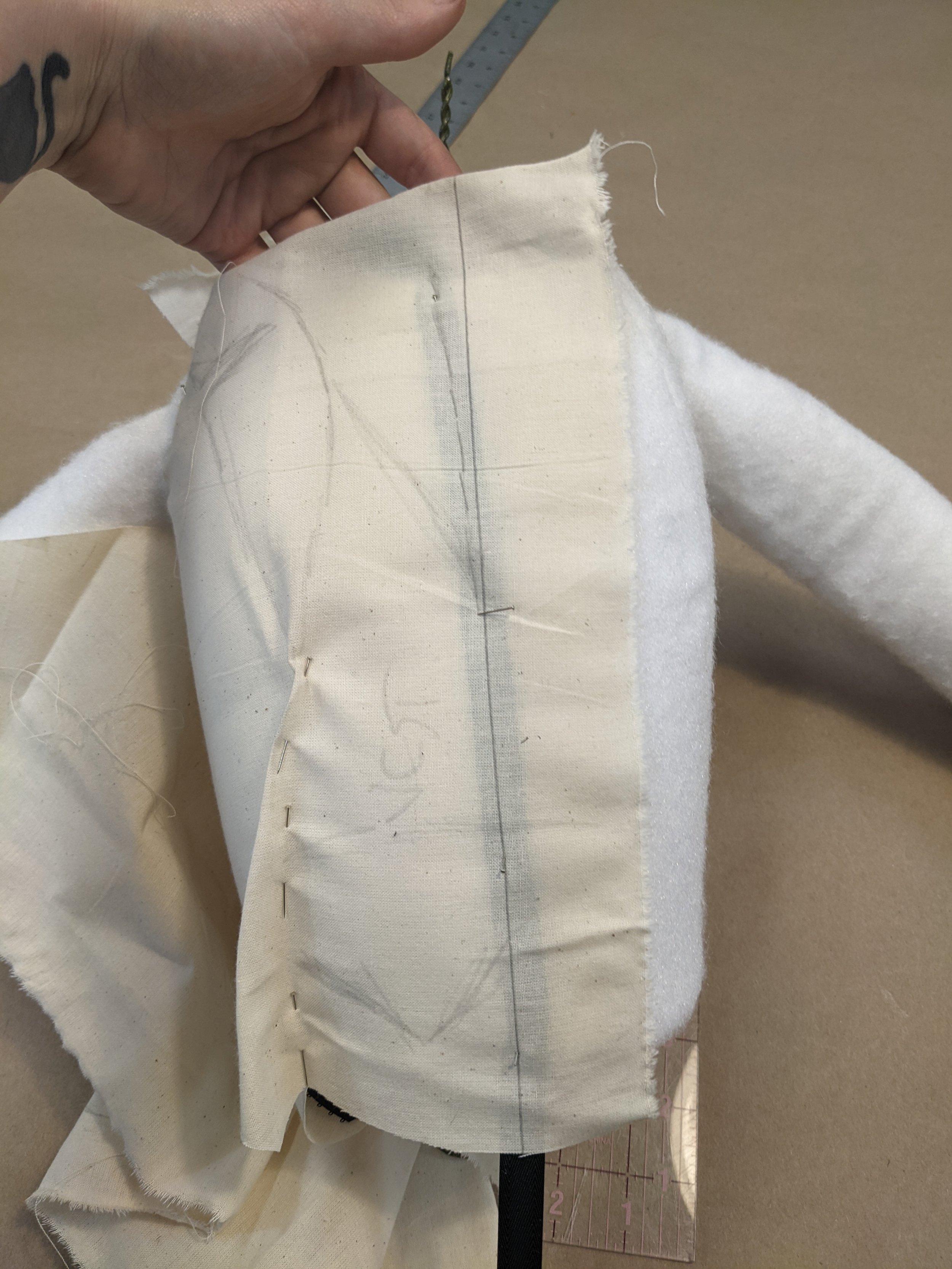 Once I covered the body as well I hung it up and draped on it as if it were a dress form to make the patterns for his clothes.