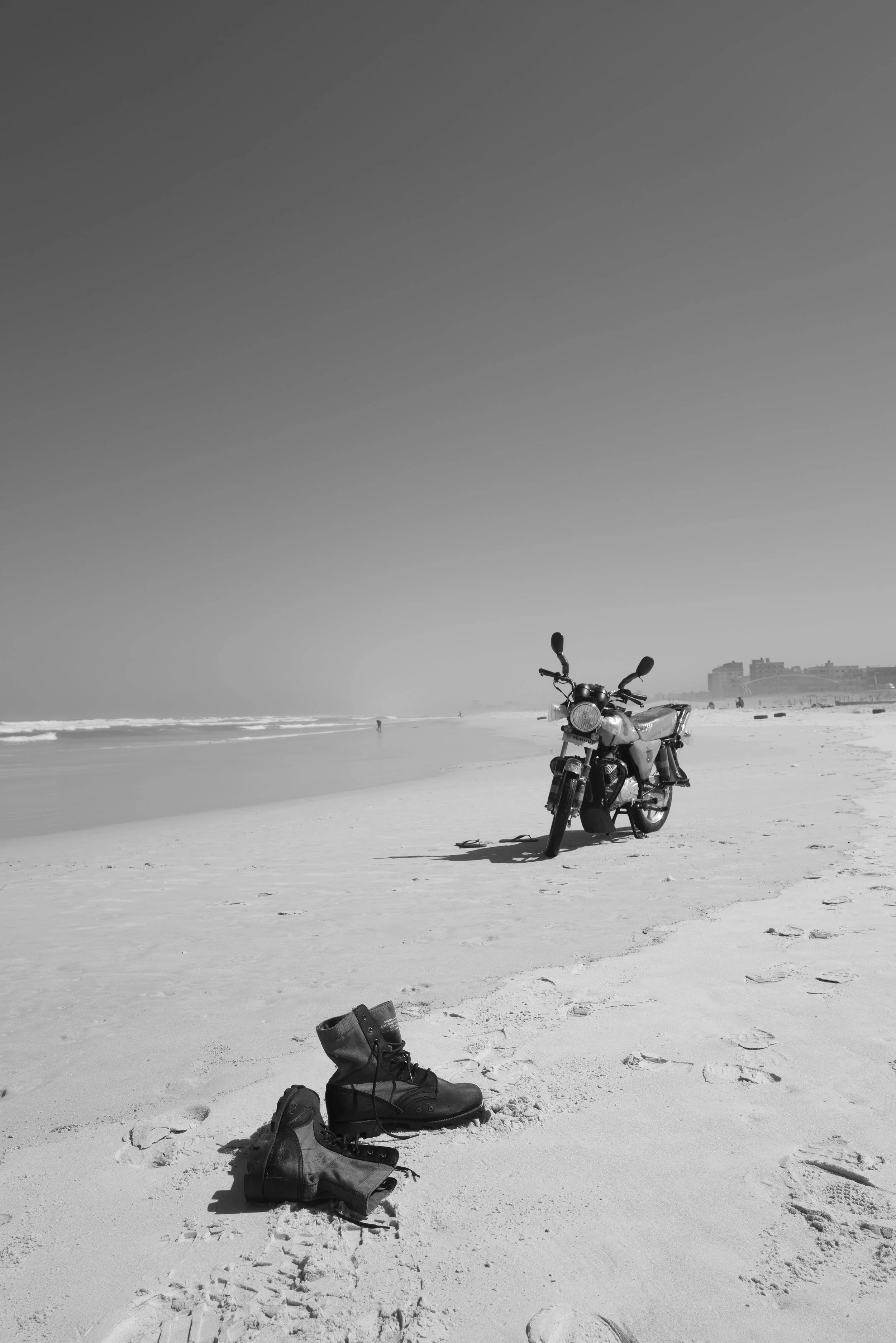 boots and a motorbike along the beachfront at Yoff Beach in Dakar, Senegal