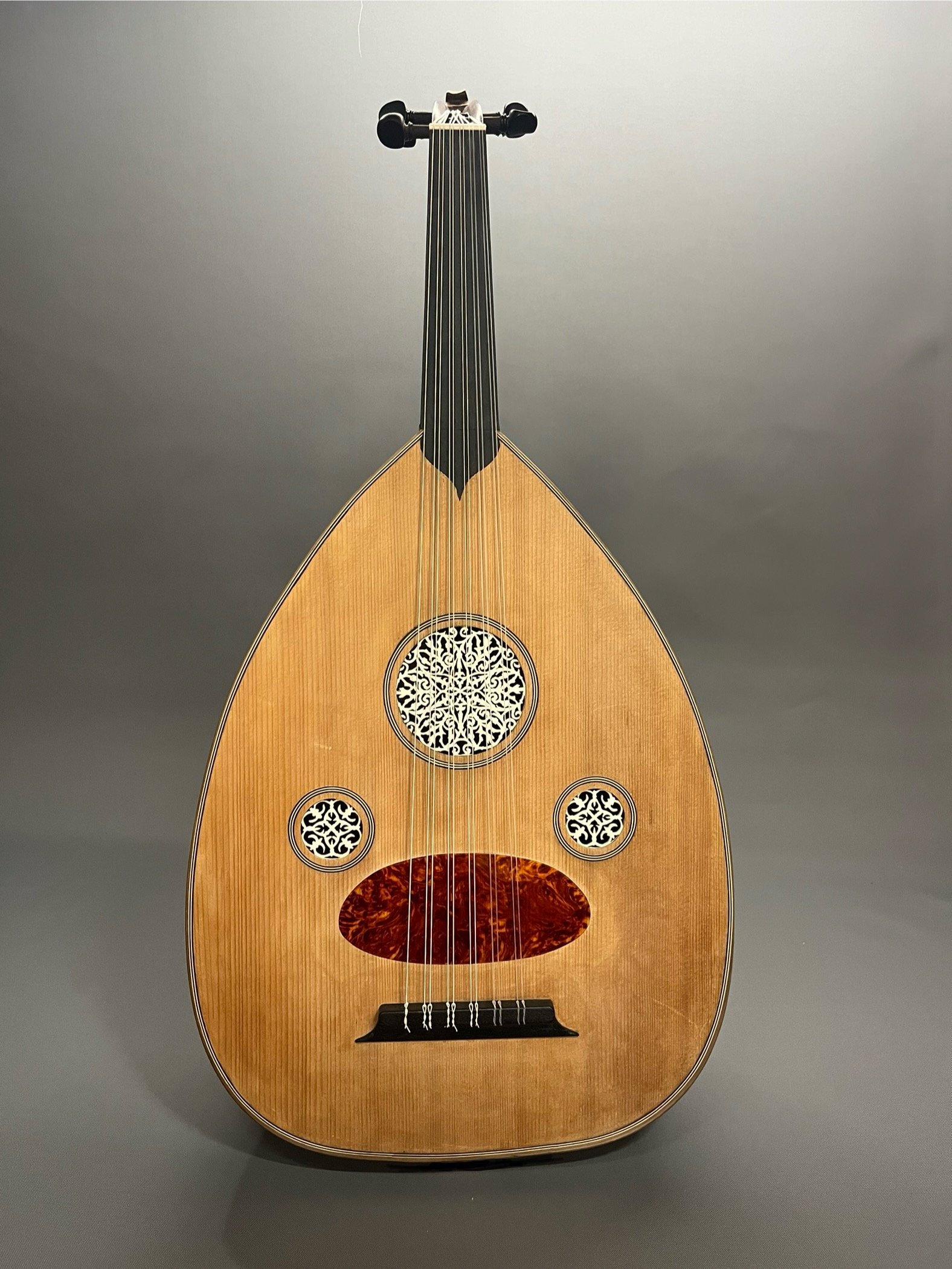 A fully restored Turkish hanim oud. The restoration included top and bowl repairs, and creation of historically-appropriate rosettes and pickguard.