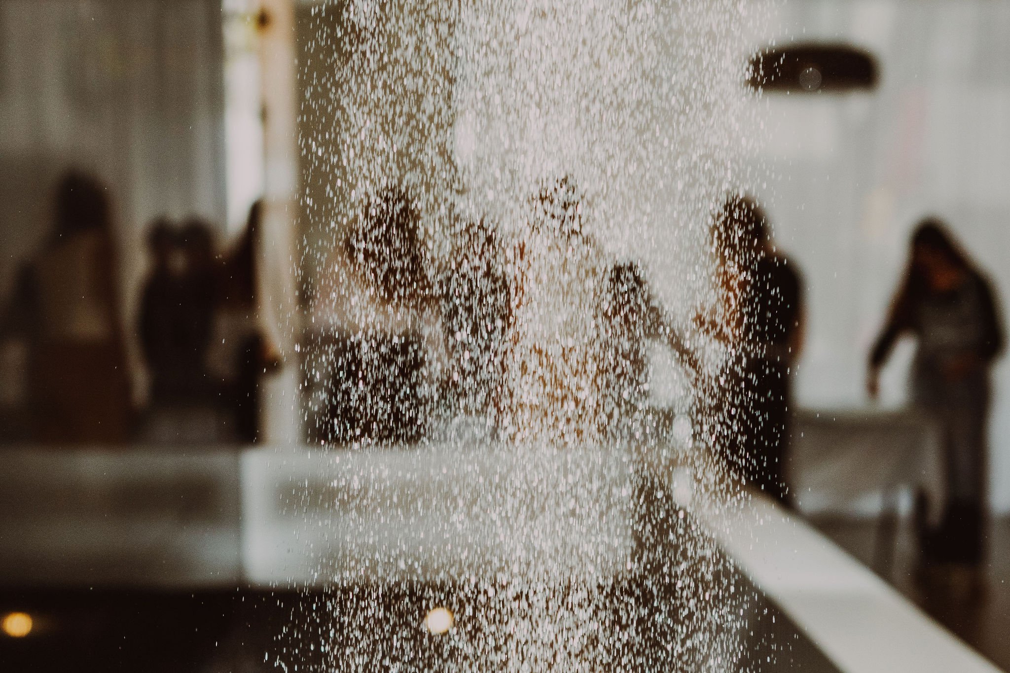 Water trickling from the wall as if floating.