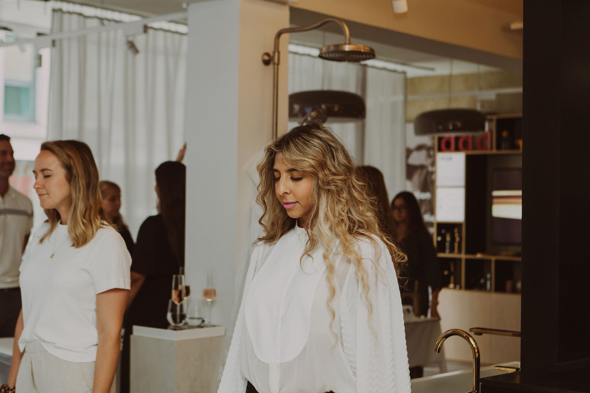 Two people standing at the workshop event.