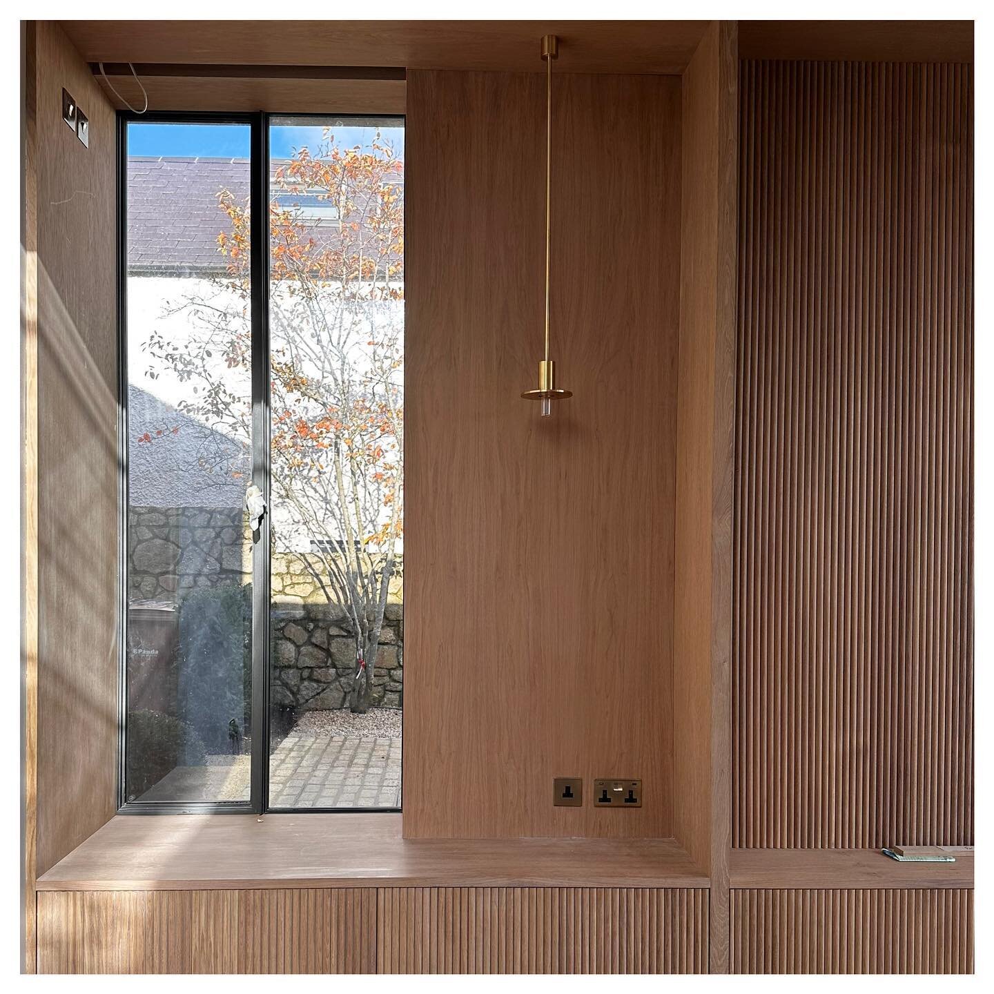 Morning light streaming through the window on this project nearing completion. Beautiful oak joinery frames the window to create a seat with a stunning brass light fitting off set. #interiordesign
#renovate
#joinery
#irishhomes 
#irishinteriors
#luxu