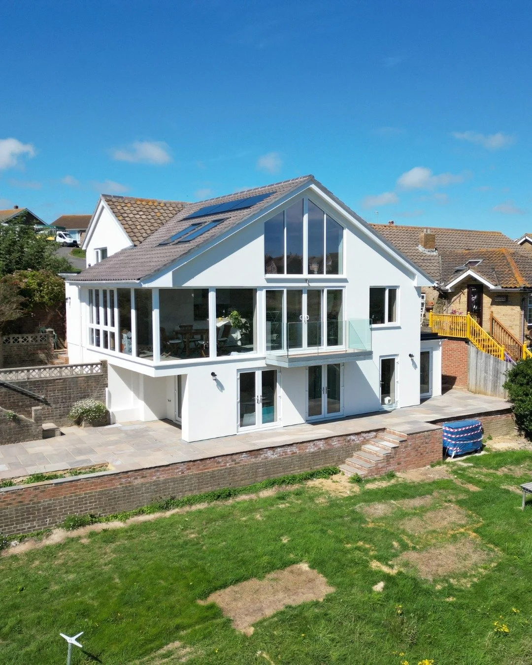 Throwback to one of our earlier projects ✨ A full transformation with a large extension, new windows &amp; doors, and an insulated silicone render exterior. Plus, underfloor heating and a state-of-the-art air source heat pump for ultimate comfort and