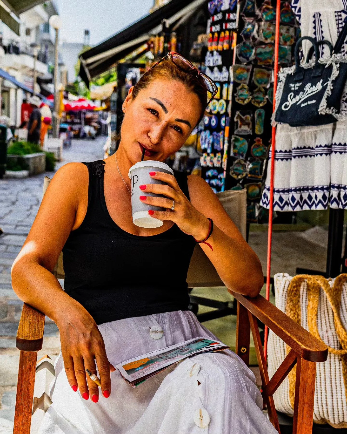 Woman drinking iced coffee and reading outside her shop, Kefalos, Kos. 🇬🇷📸
.
.
.
.
.
.
#kosphotography #kos #greecestagram #greek #greeceislands #greece #greekportraits #portraitphotography #photography #travelphotography #travelportrait #adventur