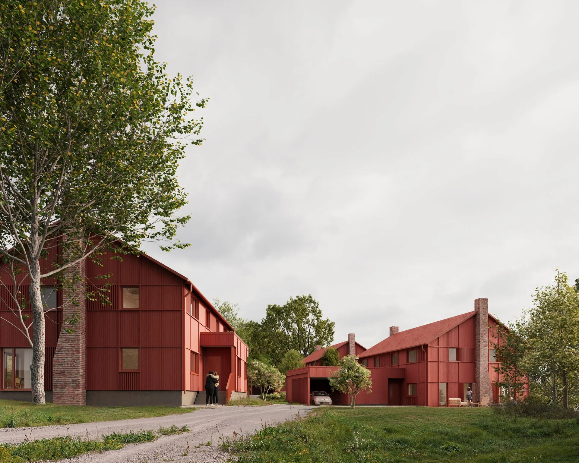 Et boligkompleks med fire røde hus med sparsomme vinduer, omgitt av grønne trær og en liten hage. Det er også et hvitt hus med norsk flagg foran.