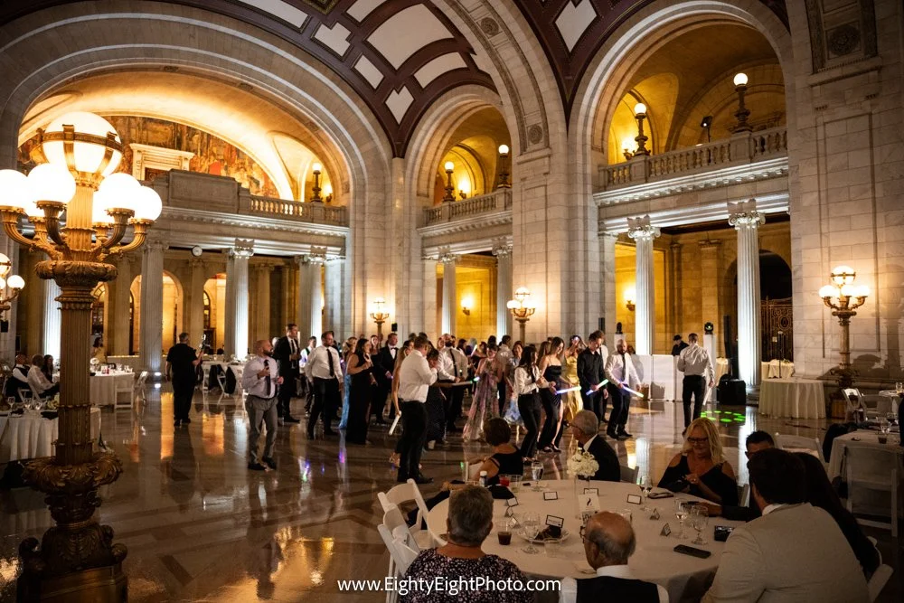 Guests dancing at Becca and Jake’s wedding reception inside Cleveland’s Old Courthouse