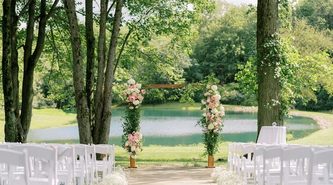 Summer wedding ceremony overlooking the water at Sun Valley Ohio in Chagrin Falls