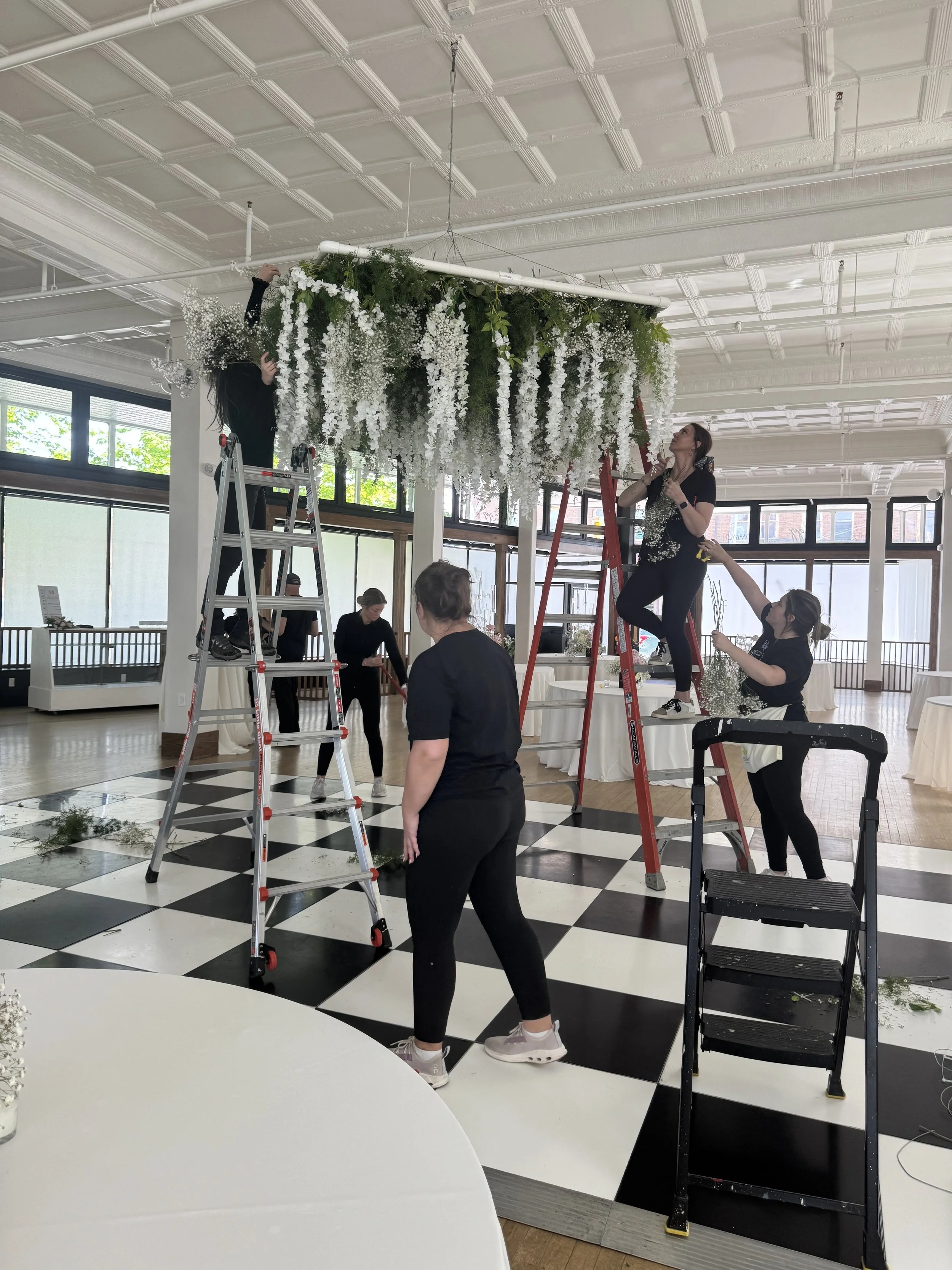 The event team arranging tables and details before a wedding reception