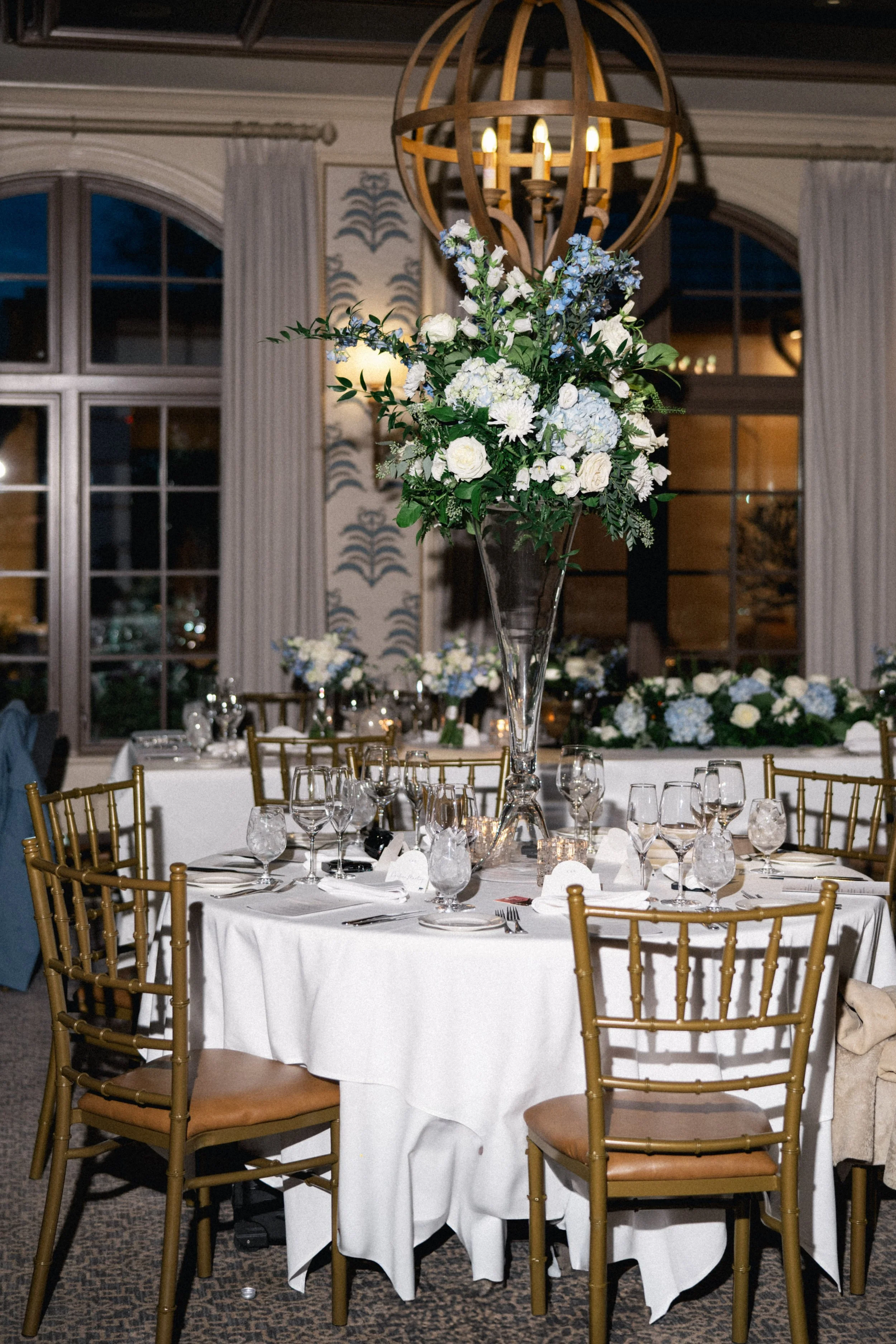 Intimate wedding reception with elegant tables and warm décor inside Cru Uncorked.