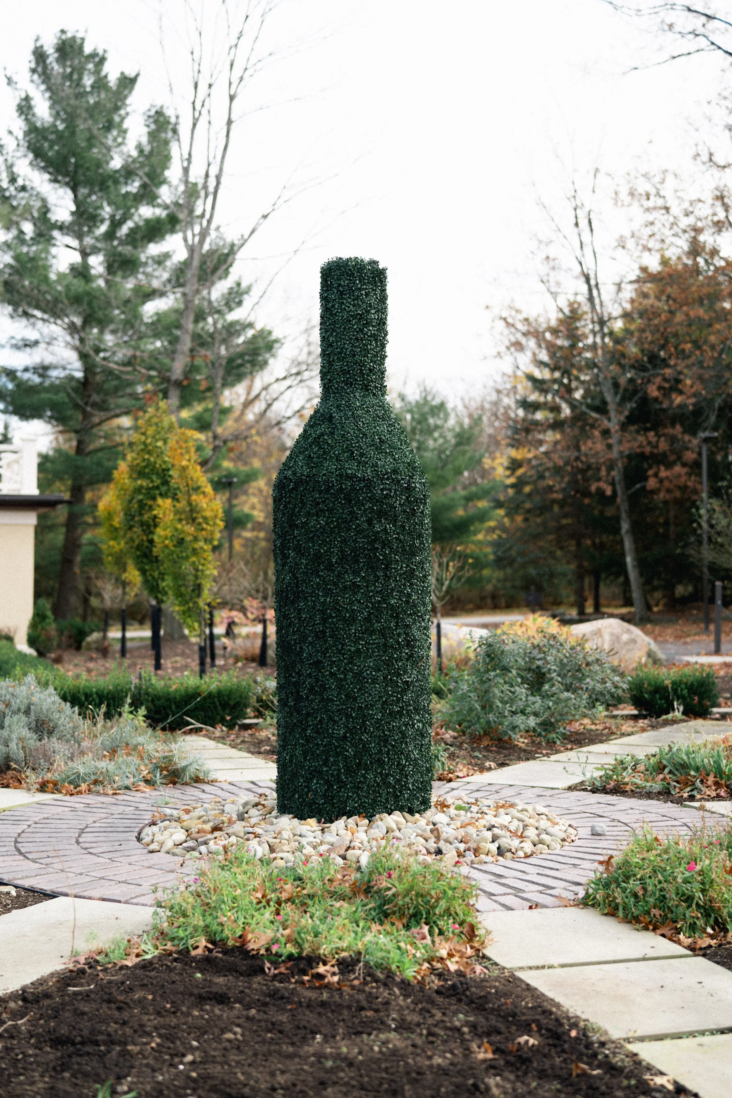 Cru Uncorked’s gardens surrounded by autumn foliage during a fall wedding.