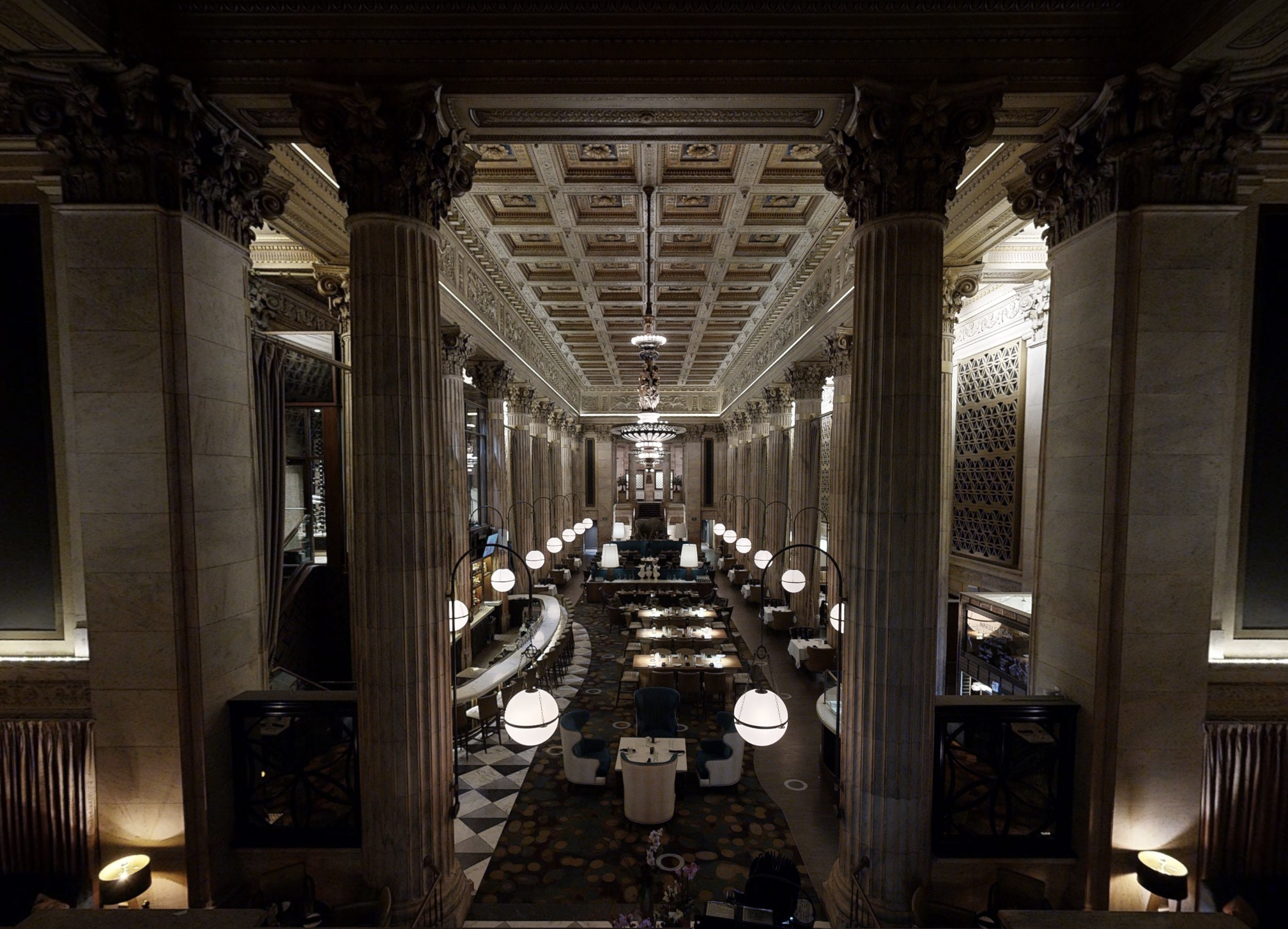 Celebration beneath chandeliers and marble columns at Marble Room Cleveland