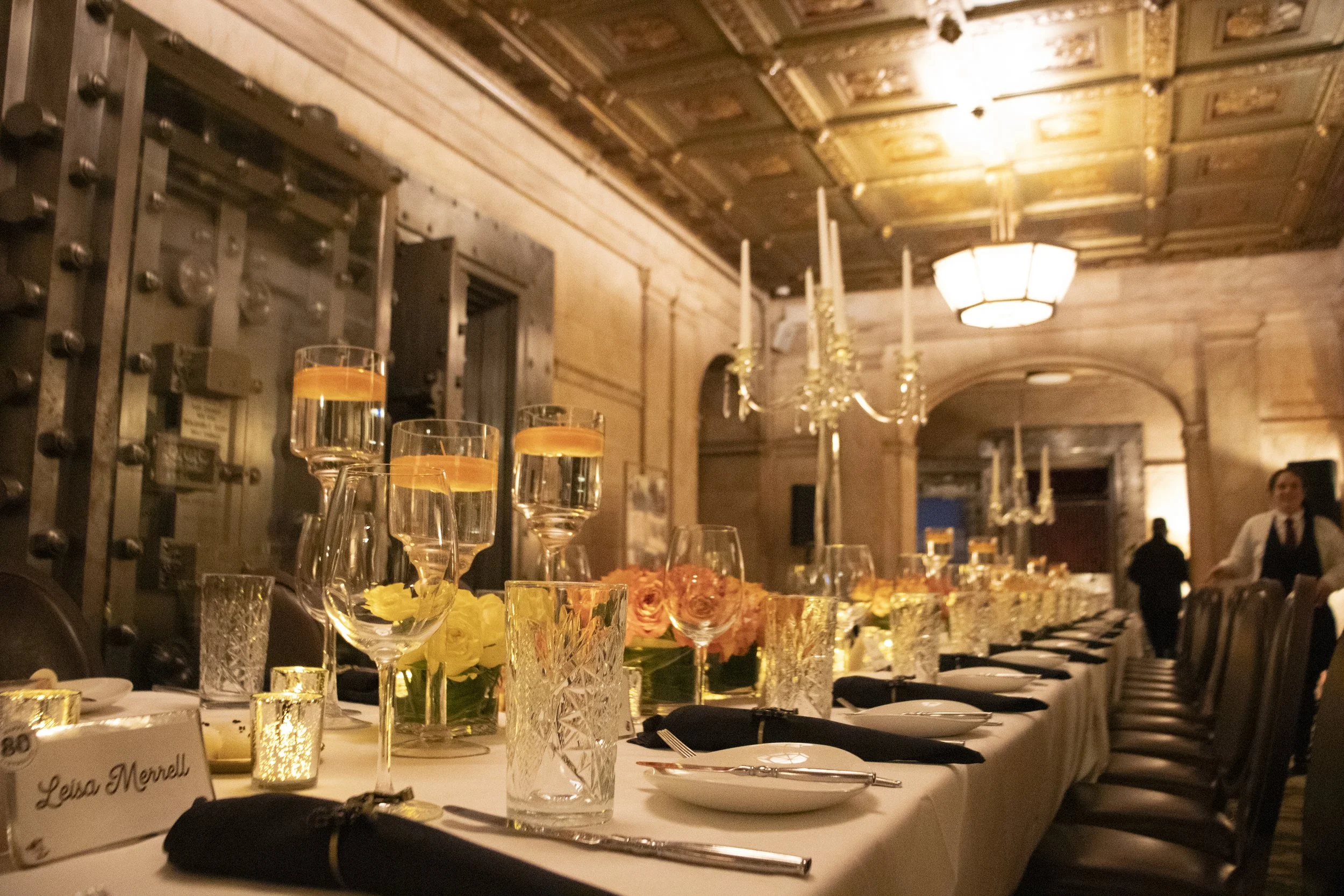 Tables set for a private celebration beneath the chandeliers at Marble Room in Cleveland