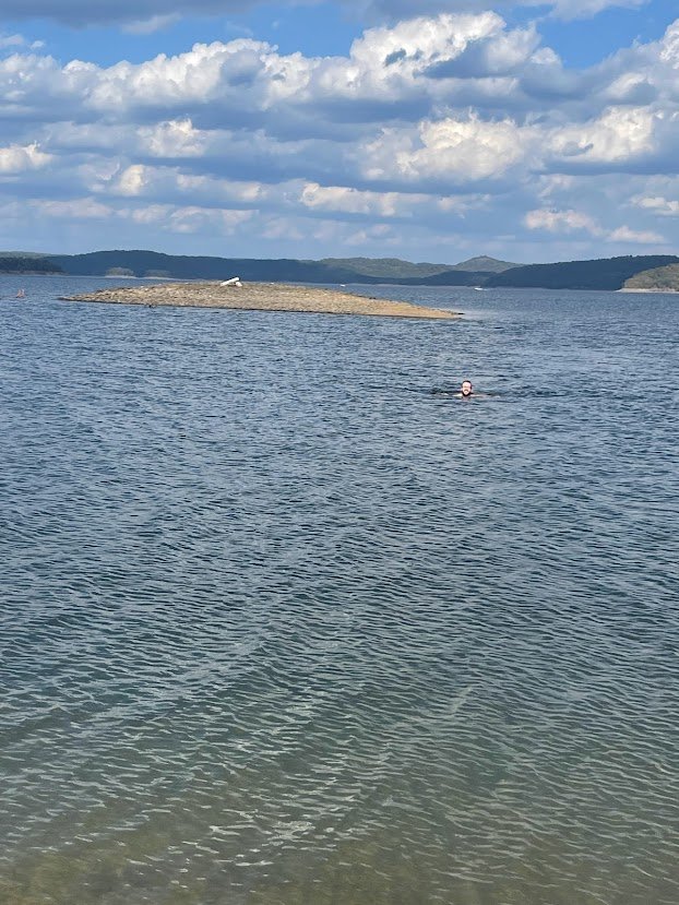Scott Emigh swimming in Broken Bow Lake.jpg