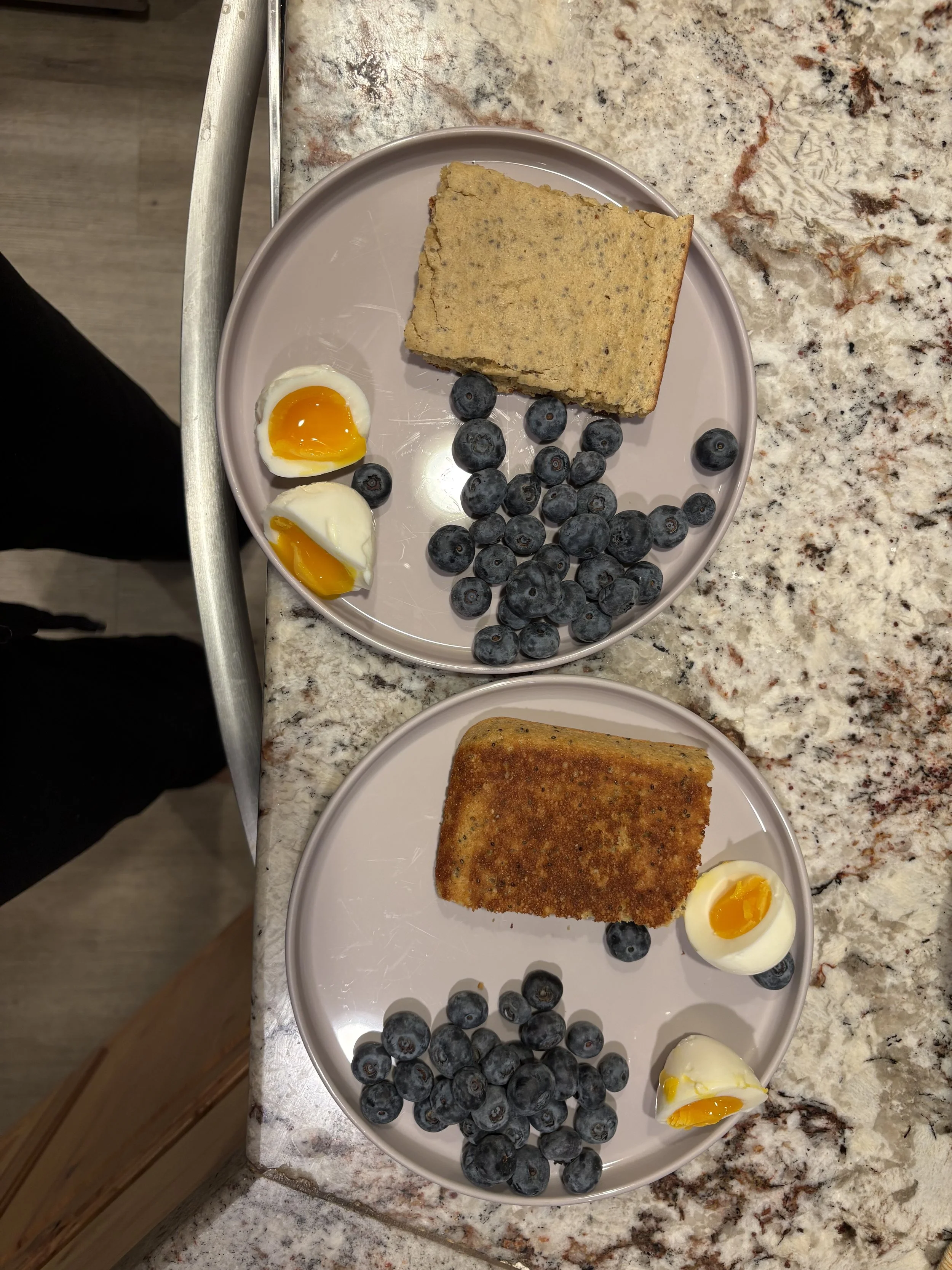 Homemade chia pancakes, hard boiled eggs, and berries