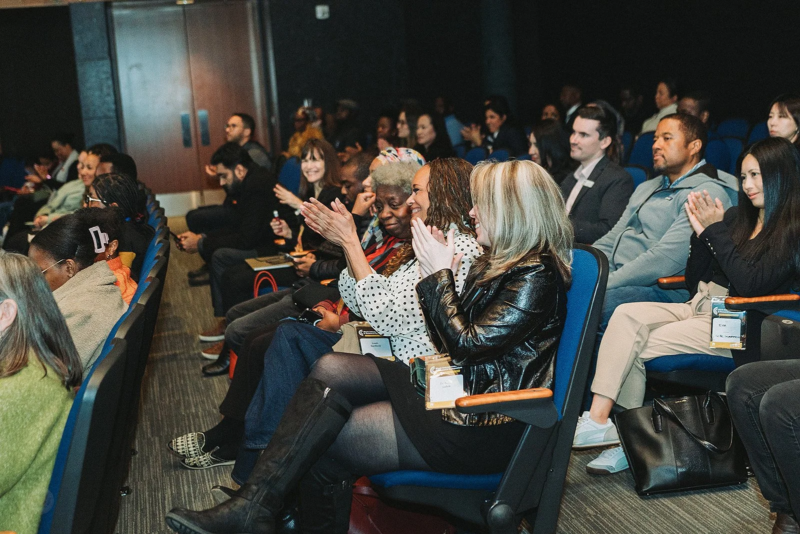 Audience in theatre clapping.jpg