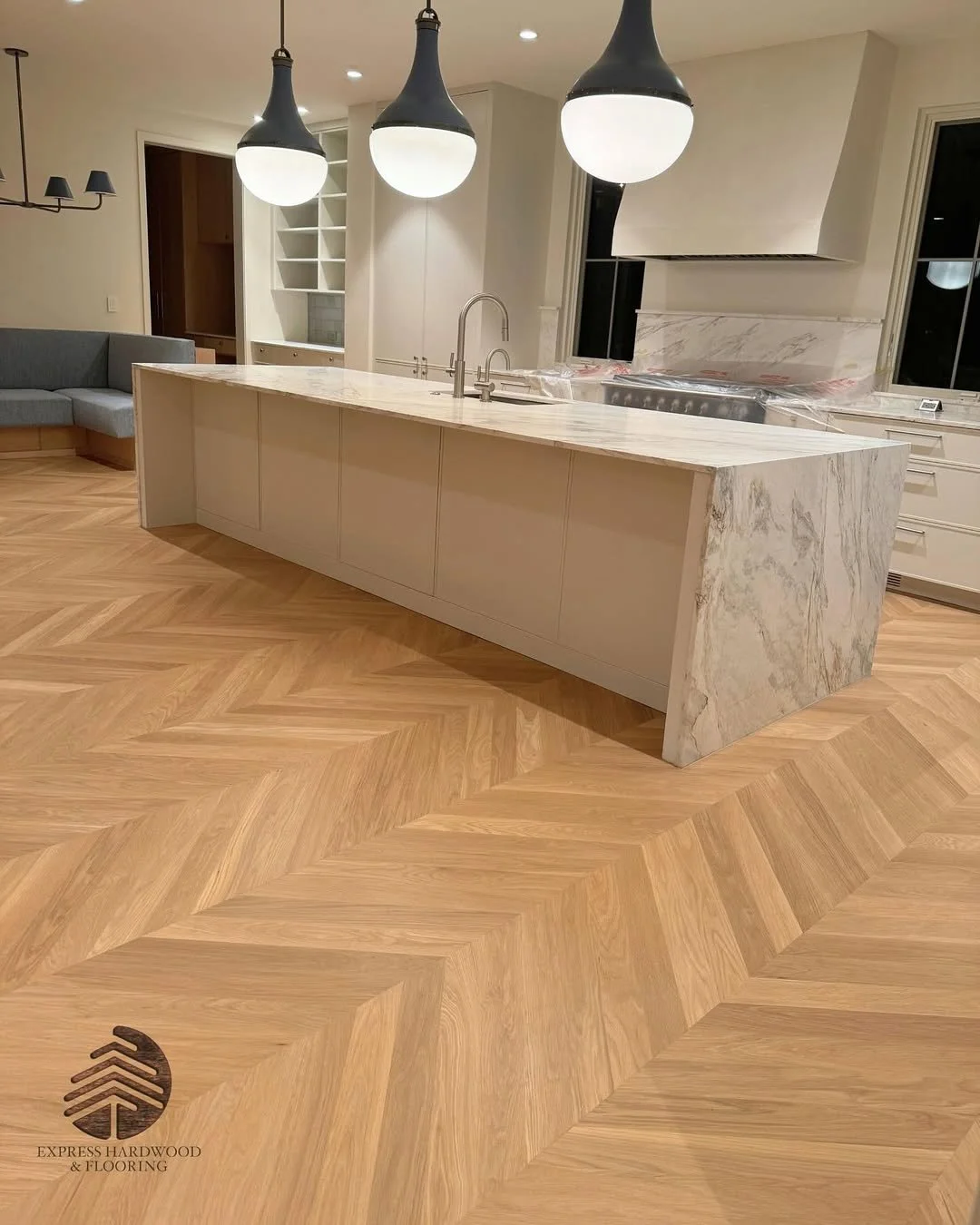 Red Oak chevron hardwood floor installed in modern interior setting