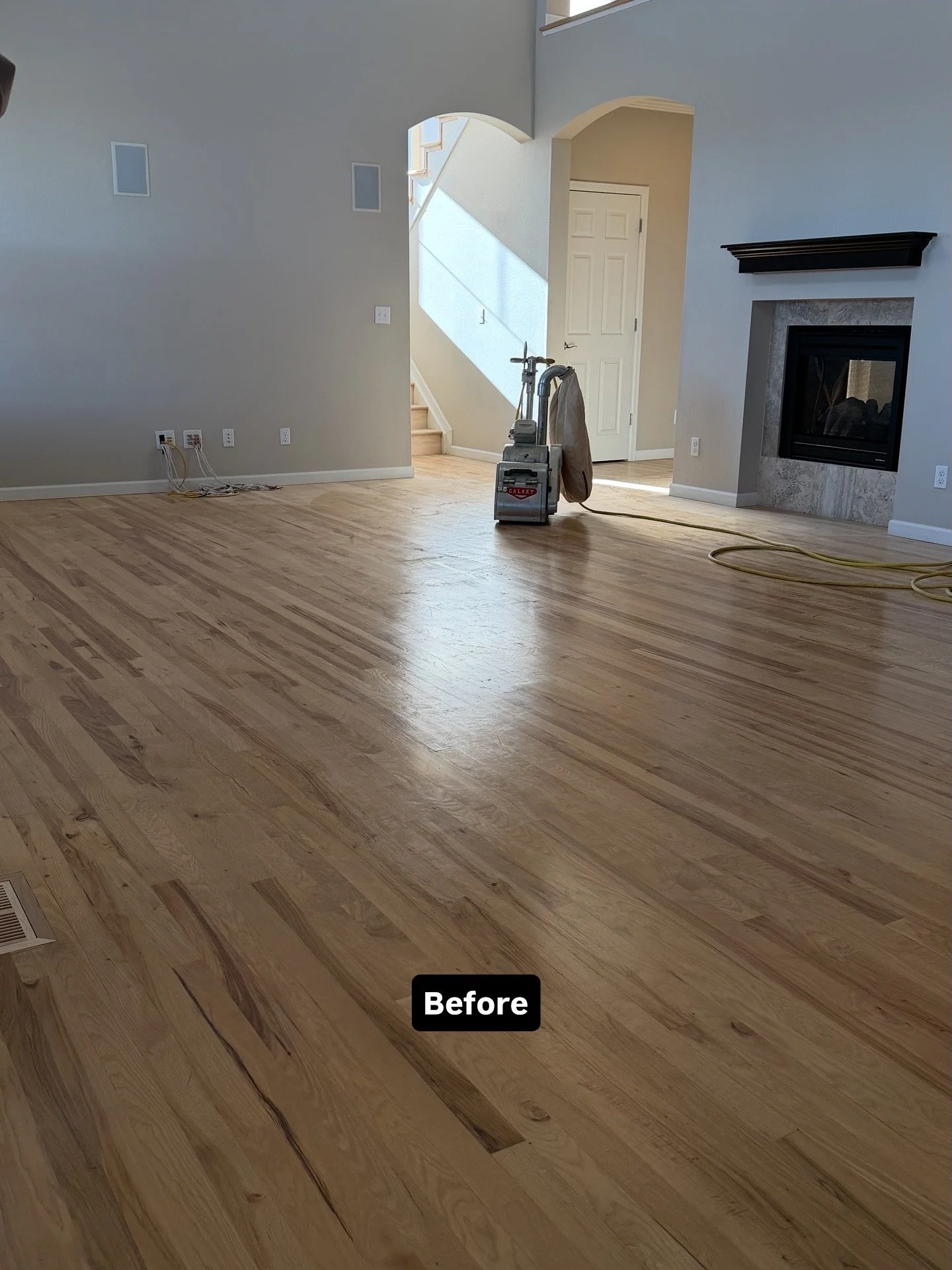 Hickory hardwood floor before refinishing in its original natural color, prior to sanding and stain application by Express Hardwood & Flooring.