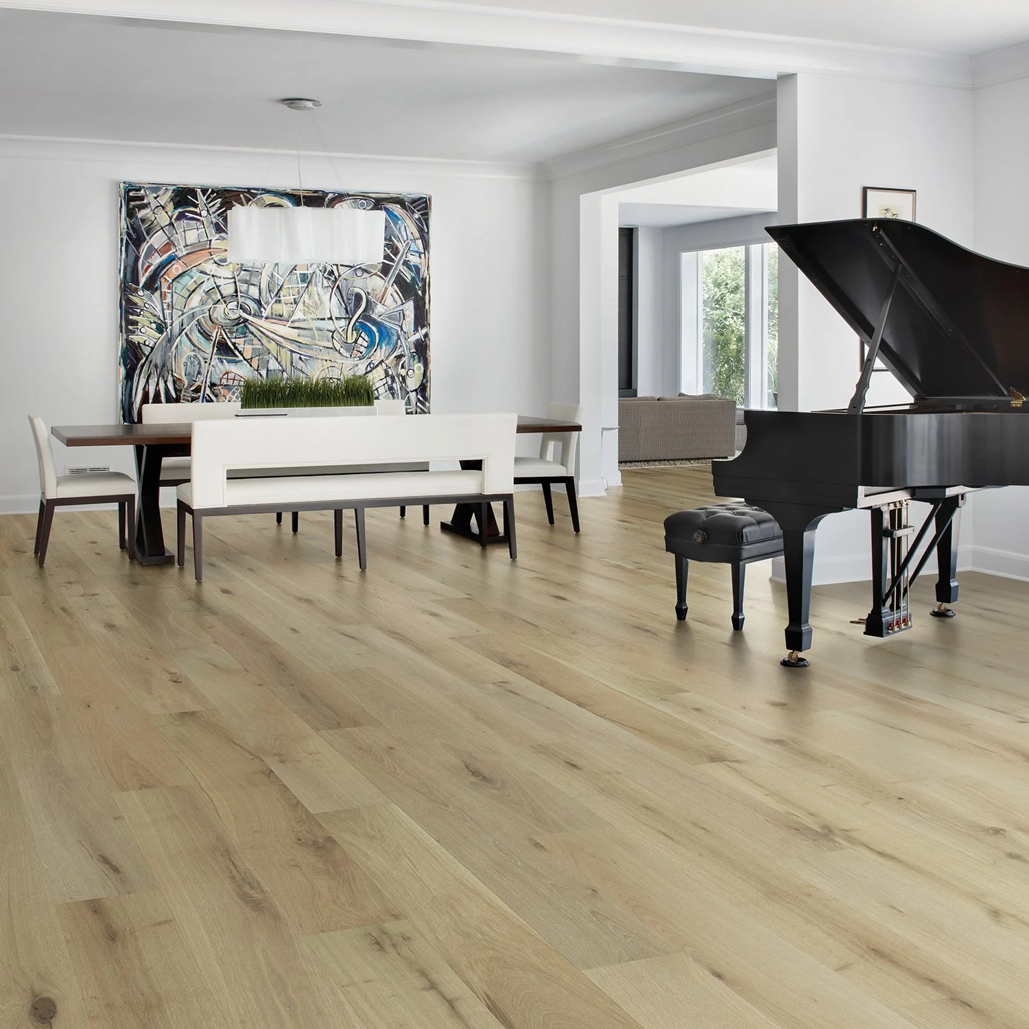 Modern dining room with a grand piano, a large abstract painting, and wooden flooring.