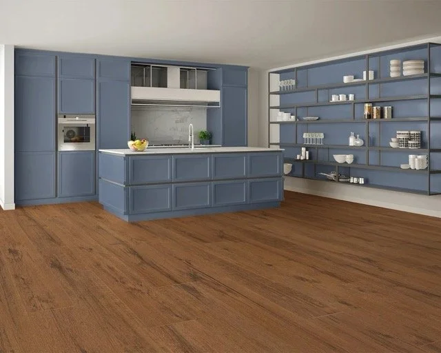 Kitchen with blue cabinets and shelves, white countertop, fruit bowl, and wooden floor