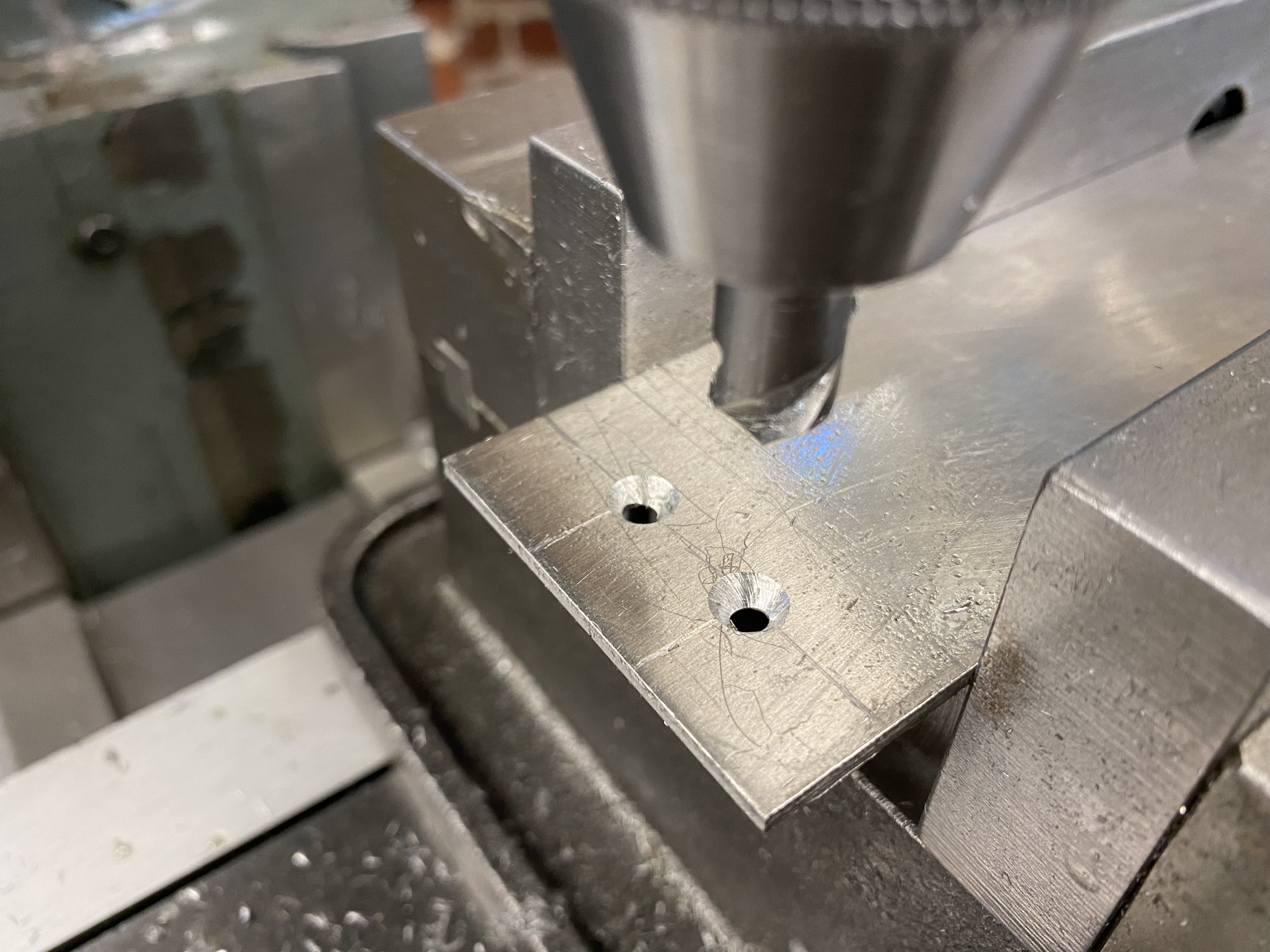 created countersinks for screws (to sit flush in sheet metal) w/ mill