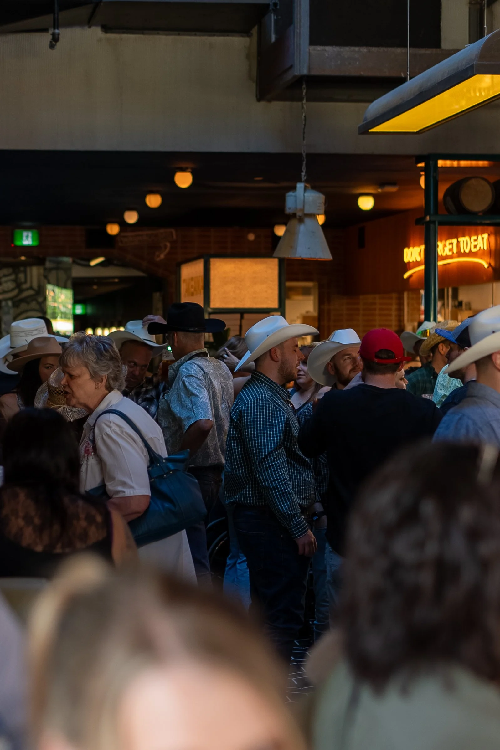 Guests at a Stampede event at Central Beltline in Calgary