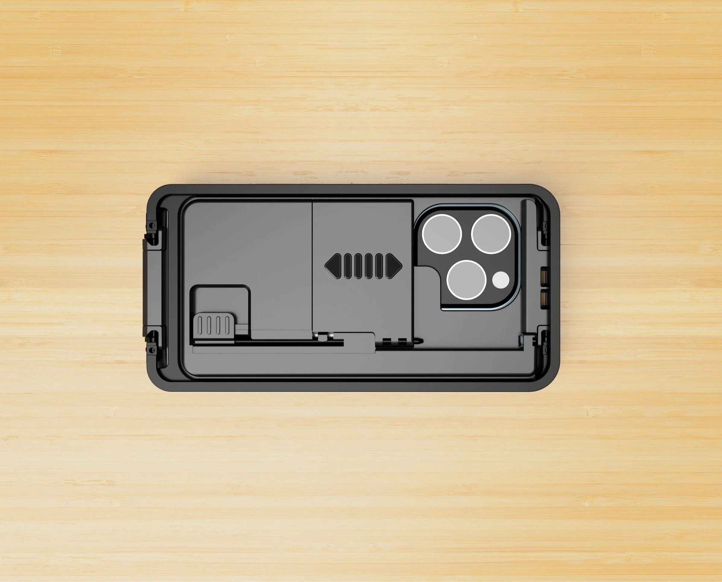 The Case for Vision for iPhone attached to an iPhone laying on a table. The case has folded legs and mirror along with an opening for the iPhone's camera.