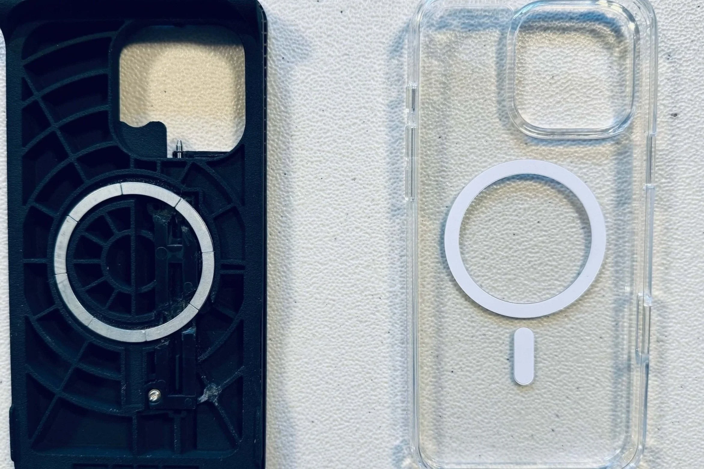 The Case for Vision MagSafe lies adjacent to a clear protective iPhone case, which will fit snugly inside the MagSafe