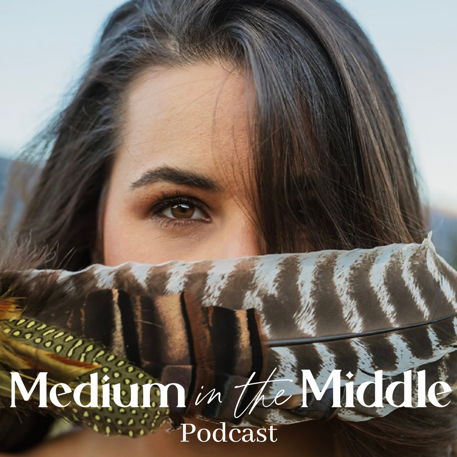 Medium in the middle podcast cover art, Stephanie Kamille's face with a large feather over her nose and mouth