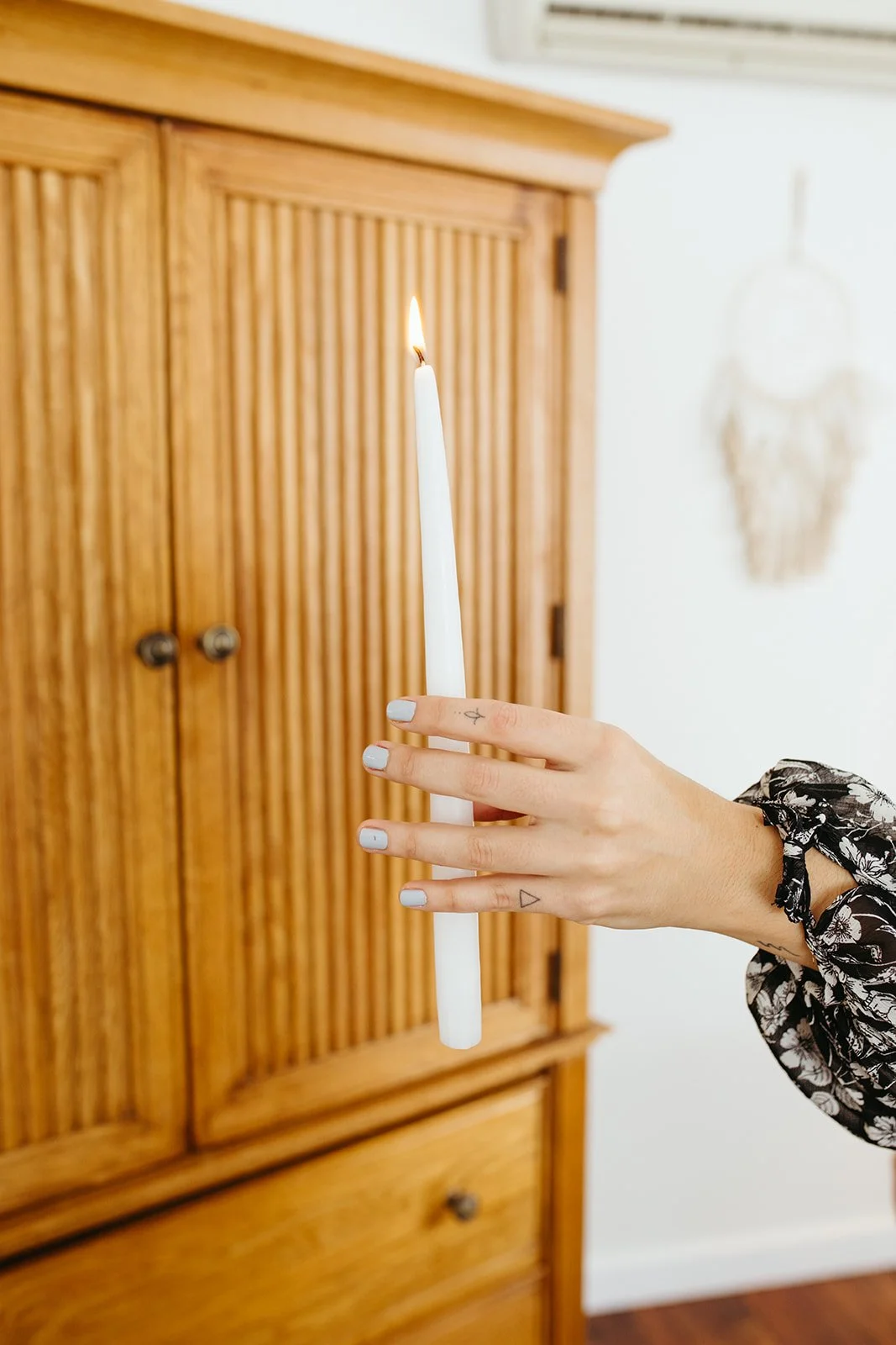 Stephanie Kamille holding a white candle