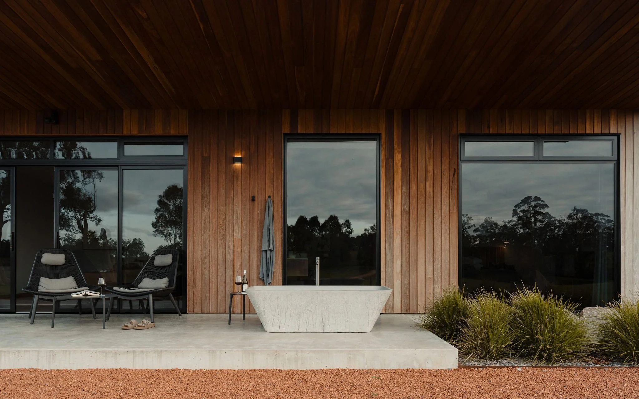 Timber cladding on exterior of chalet with concrete bath