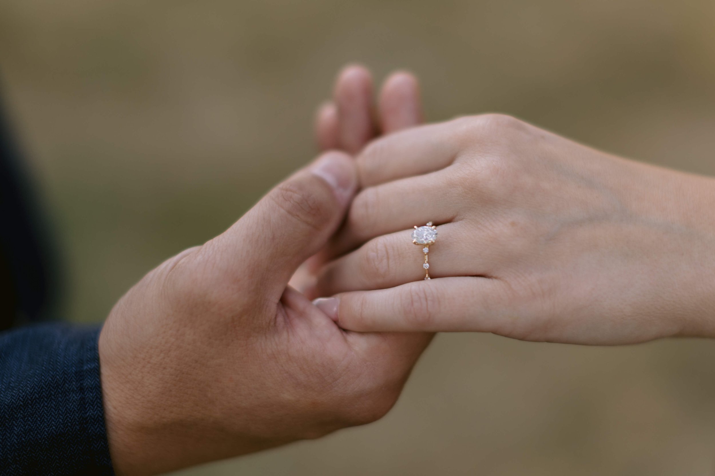 Engagement Photographer in Copenhagen: boyfriend holding the engagement ring