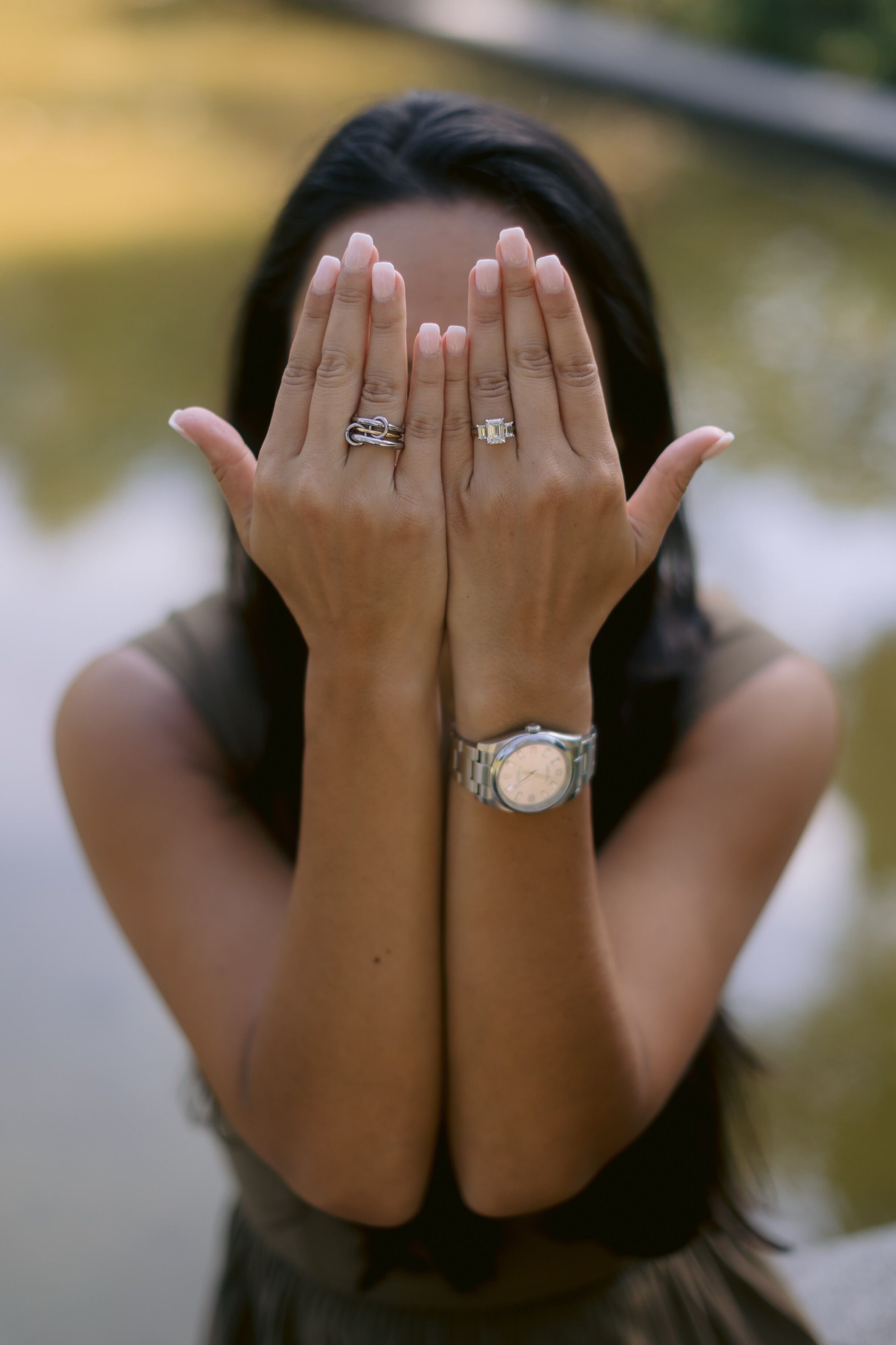 Engagement Ring: a girl covering her face