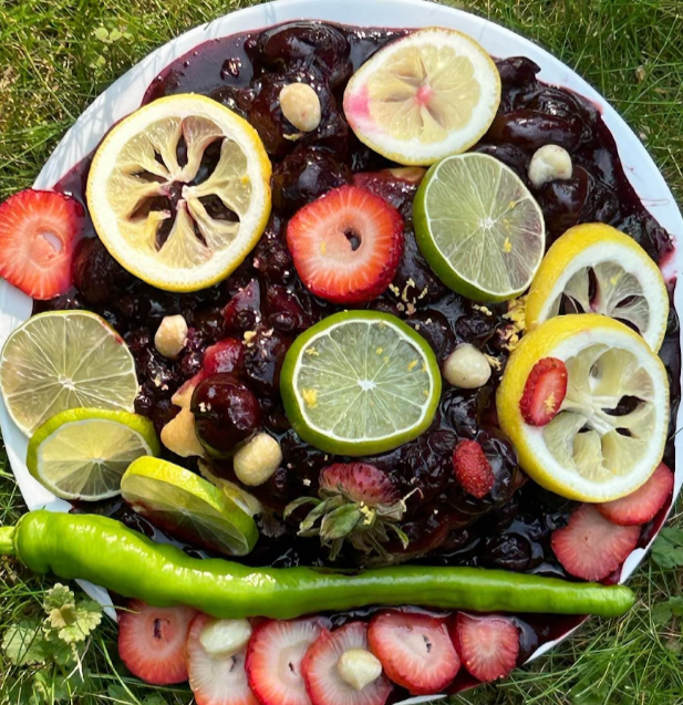 berry birthday cake topped with an abundance of fruits (2023)