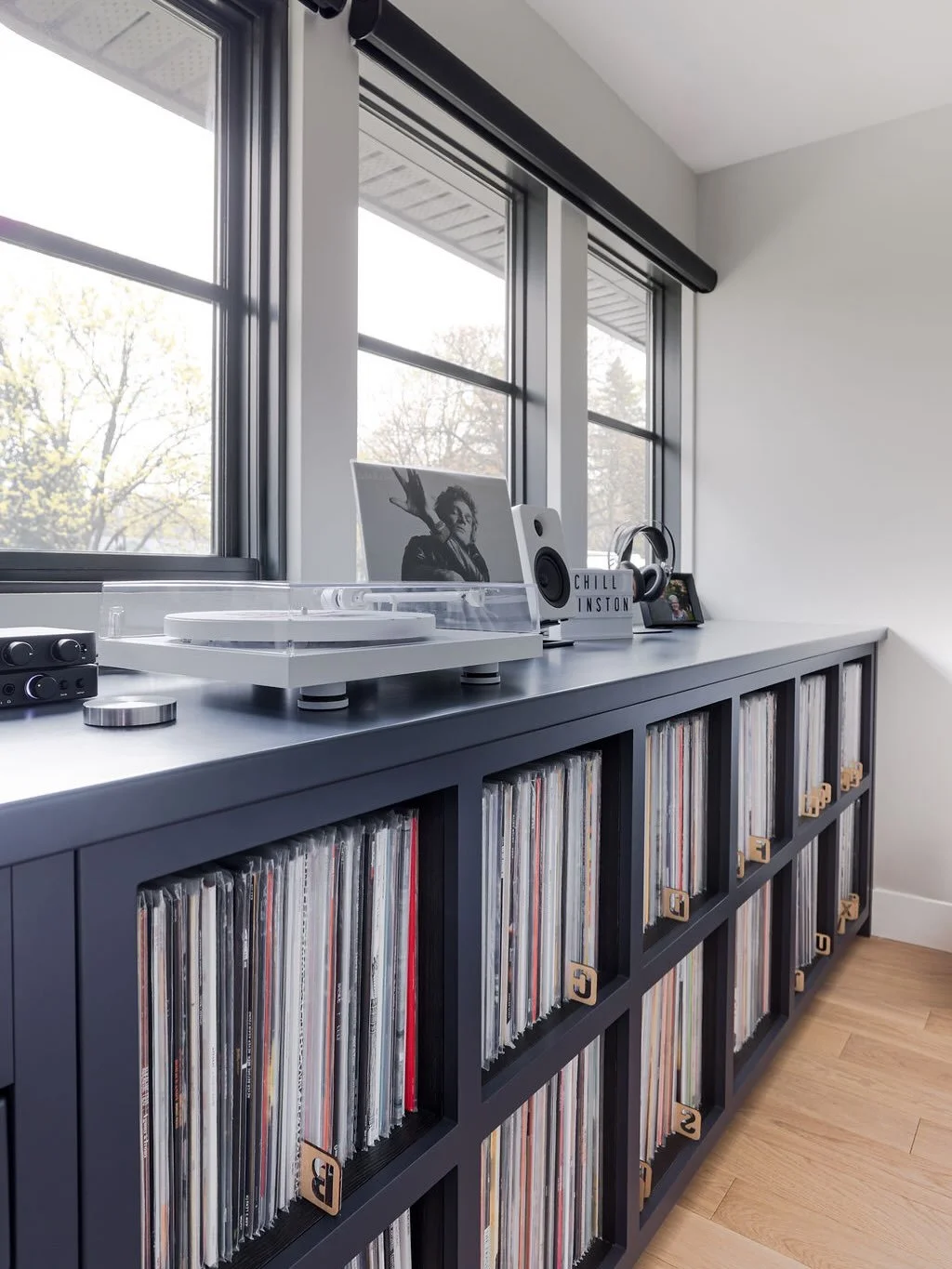 An office and music listening room with storage for an epic vinyl collection. 

Which album are you listening to first in this room? 

Design: @leodesigninteriors 
Millwork: @blackstonecabinetrydesign
📸: @peachmedia_ca