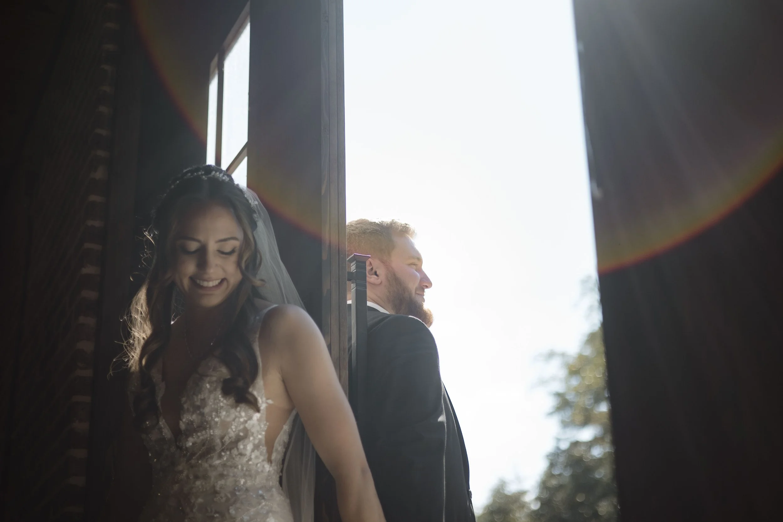 A newlywed couple smiling at Holston Springs, a Tennessee wedding venue