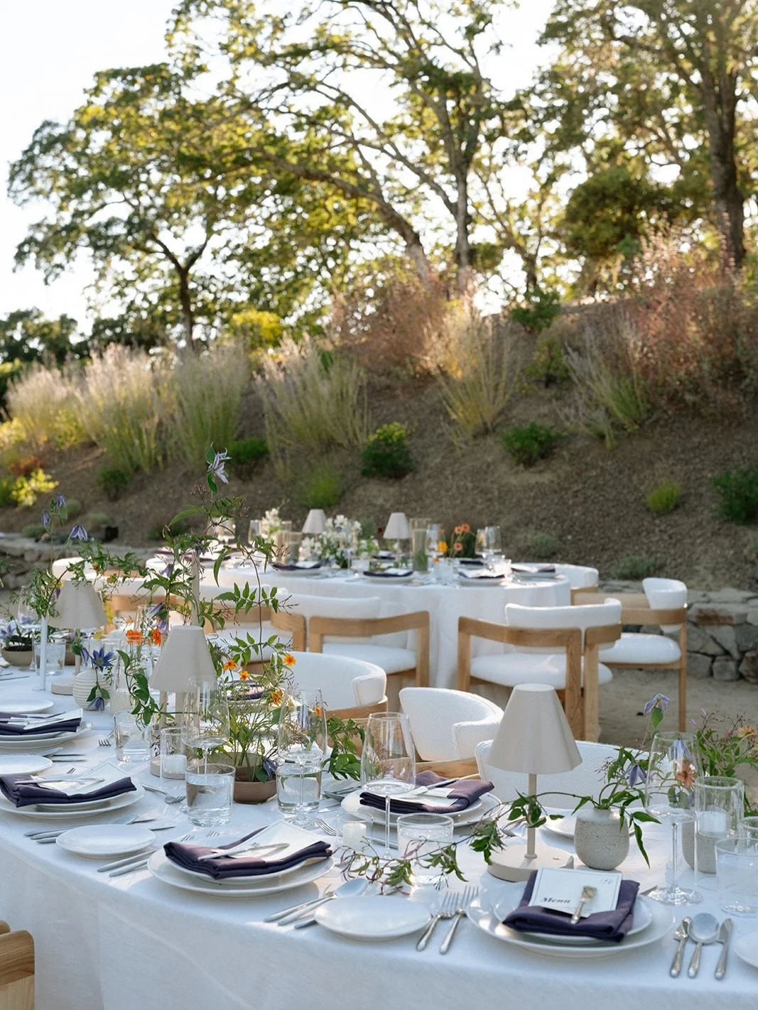 One of our favorite tablescapes to design for&ndash;
jasmine vines trailing across the tables, airy clematis dancing throughout, and cheerful pops of marigold adding warmth

Planning &amp; Design | @amriandco
Photography | @sincerelysini
Videography 