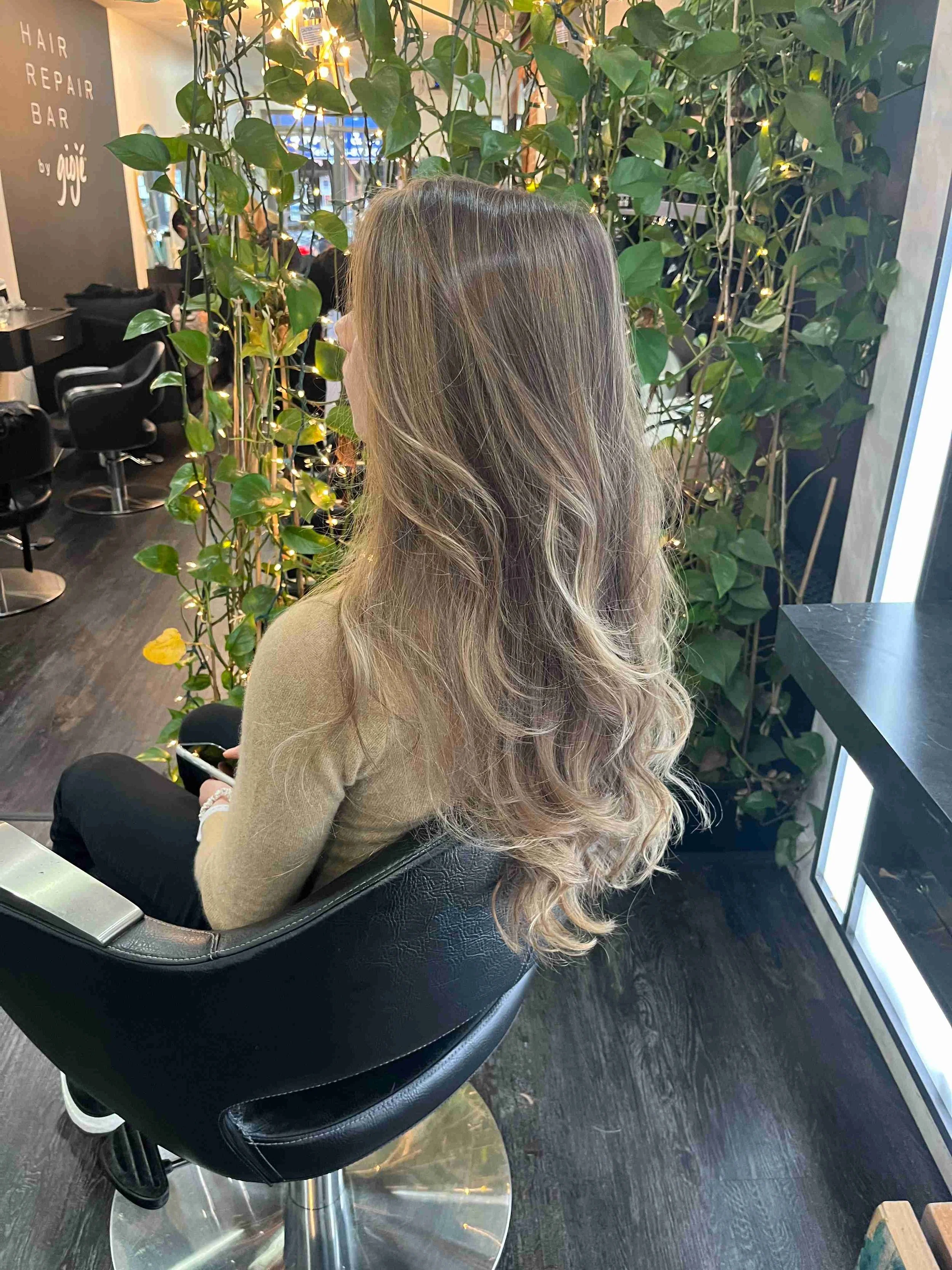 Women's haircut on long blonde hair