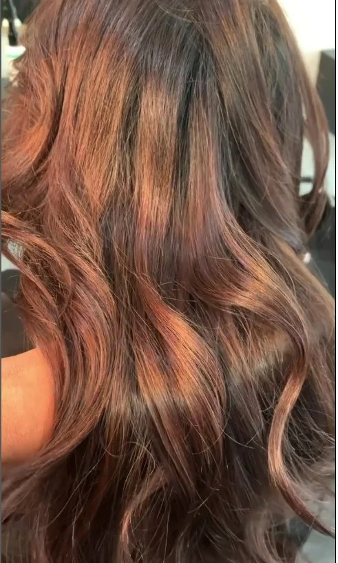 Split end removal treatment results on brunette curls