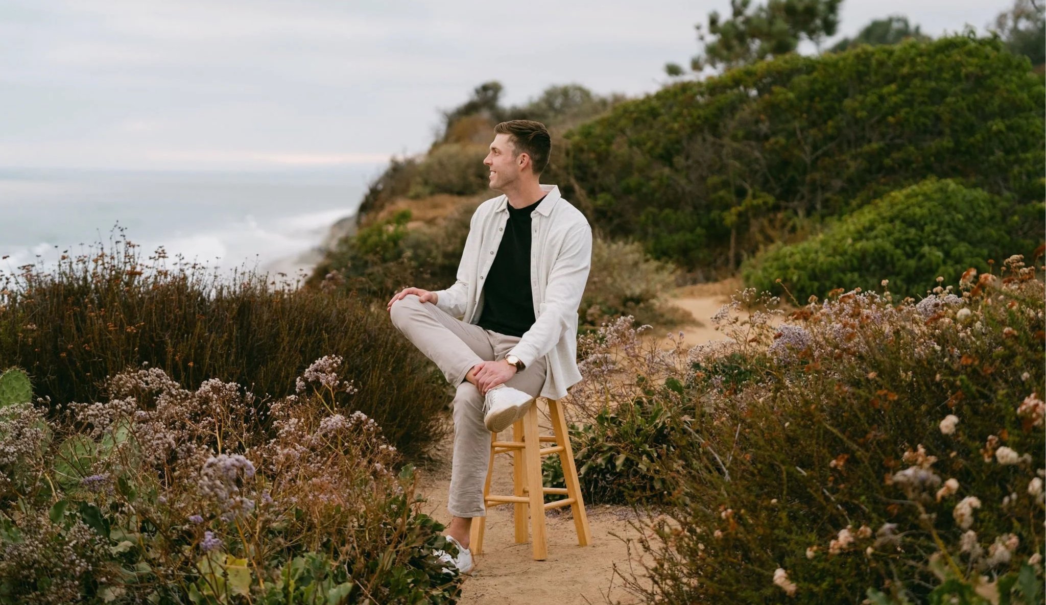 Professional outdoor portrait of a graduate student at Torrey Pines State Natural Reserve in San Diego.
